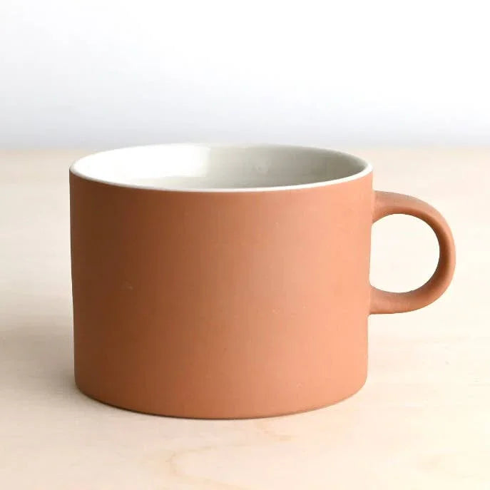 Hasami porcelain terracotta mug, minimalist design, matte clay exterior, natural brown color