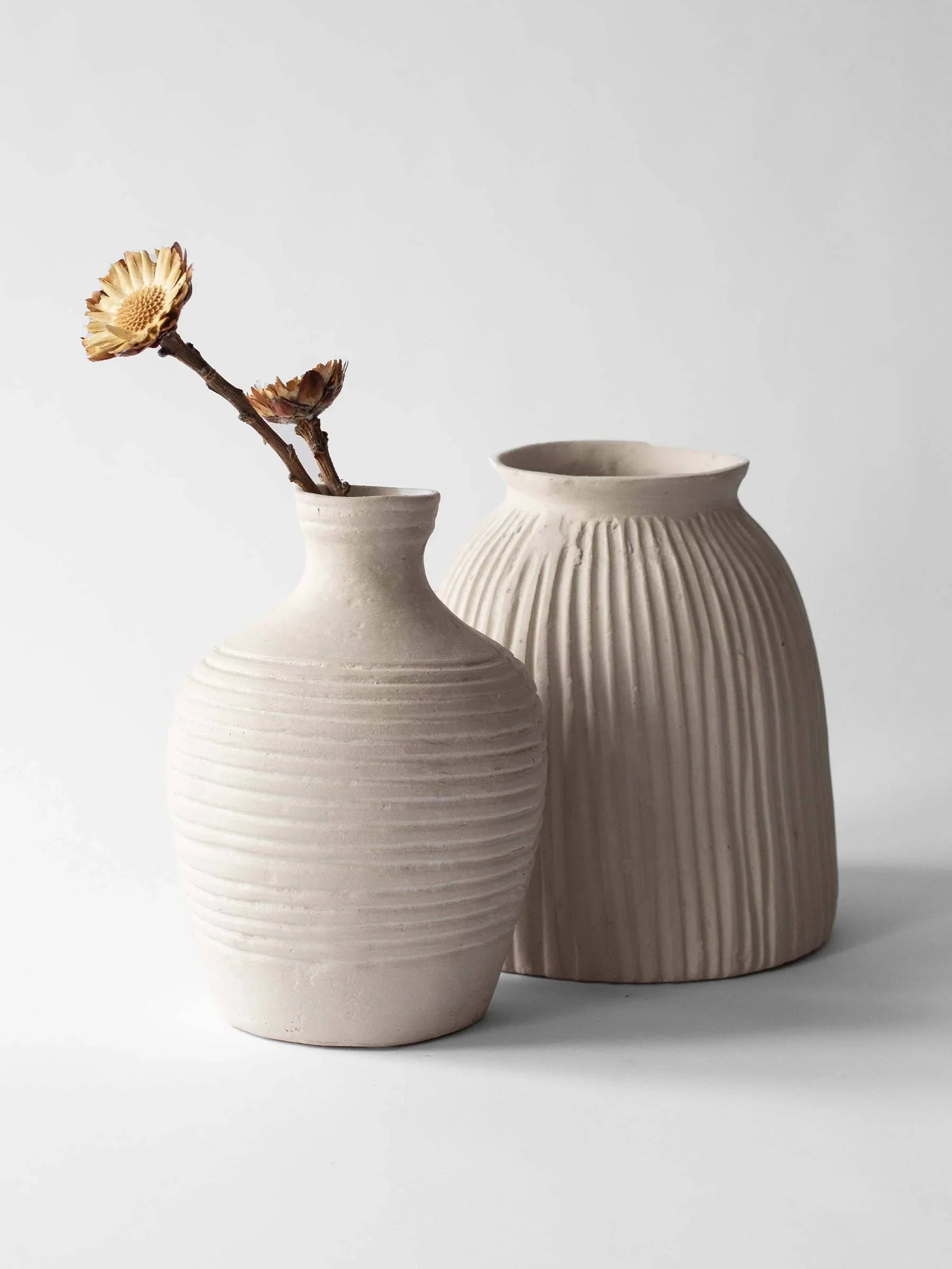 Handmade neutral-toned ceramic vases by Haarn, ribbed texture, minimalist decor