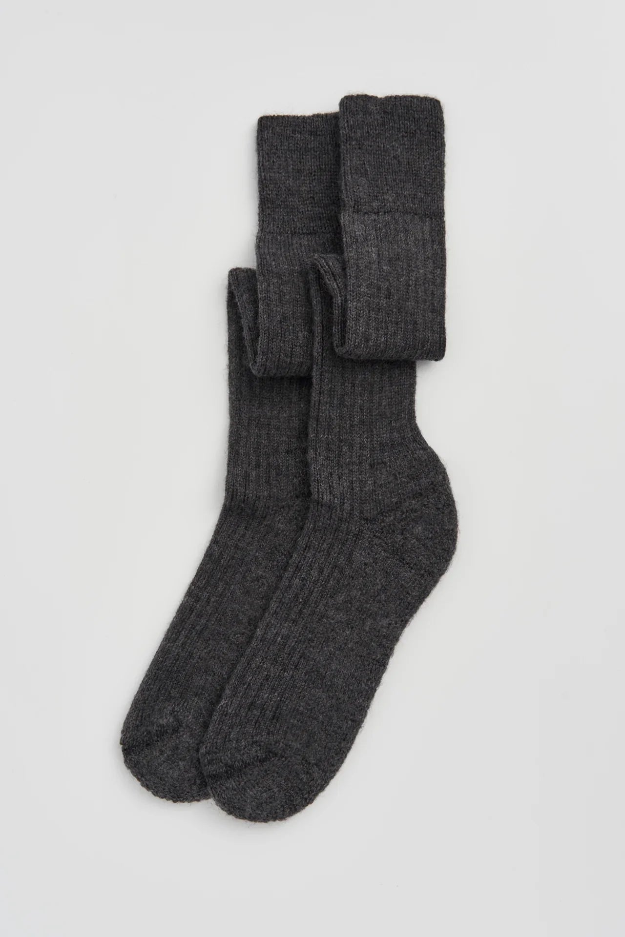 Deiji Studios dark grey ribbed wool socks on white background