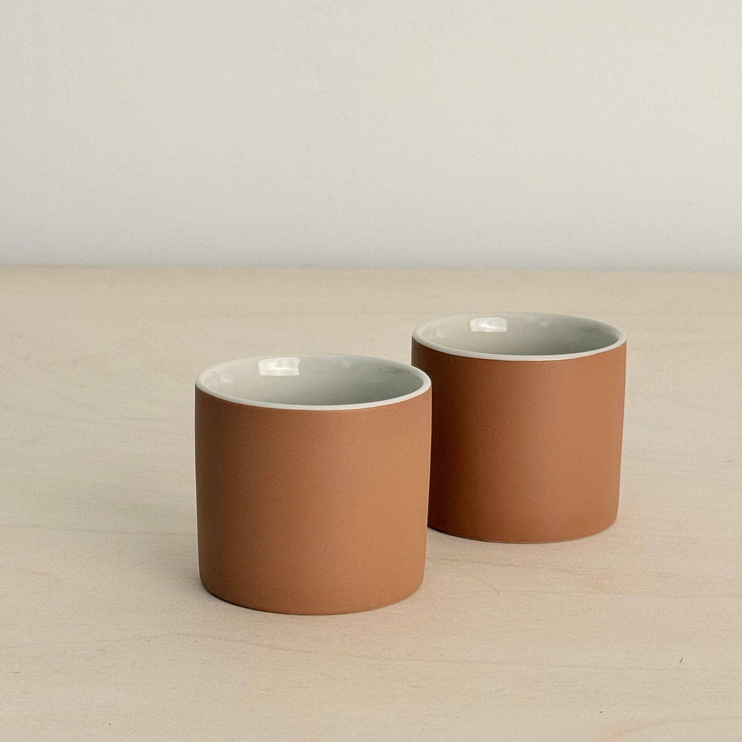 Yield ceramic cups set, matte terracotta exterior, white interior, minimalist design