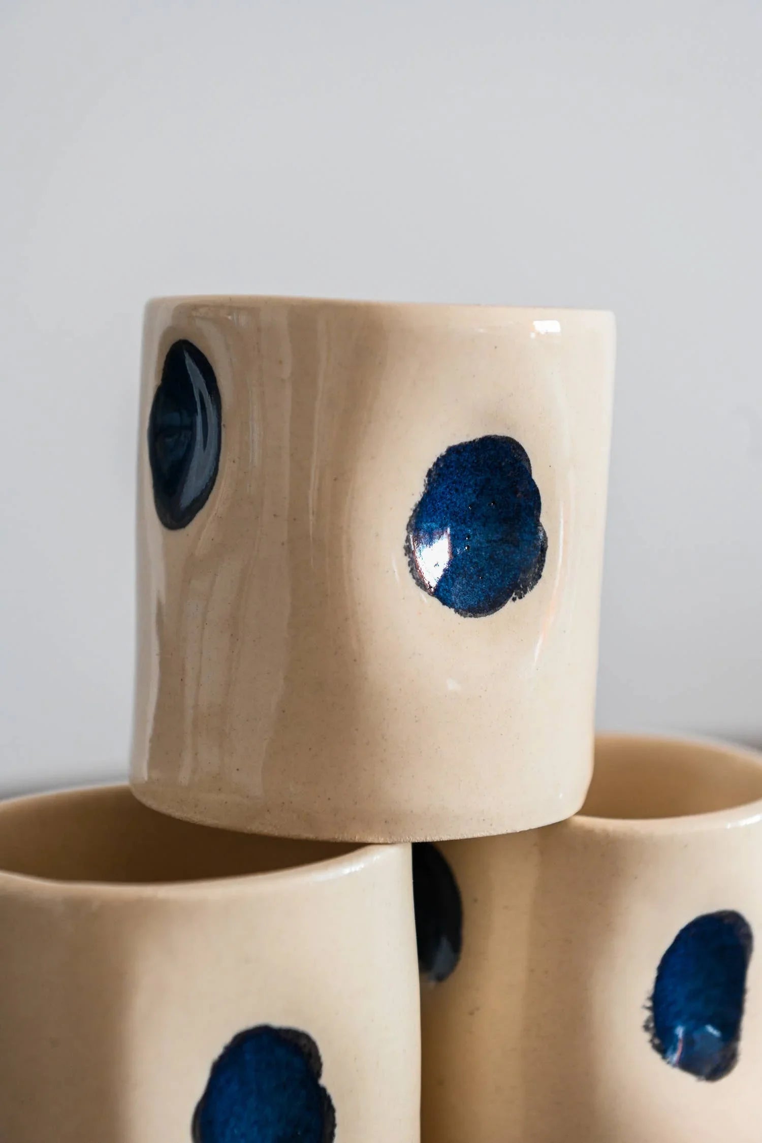 Good Kind Work ceramic mugs, cream stoneware with blue dots, minimalist design