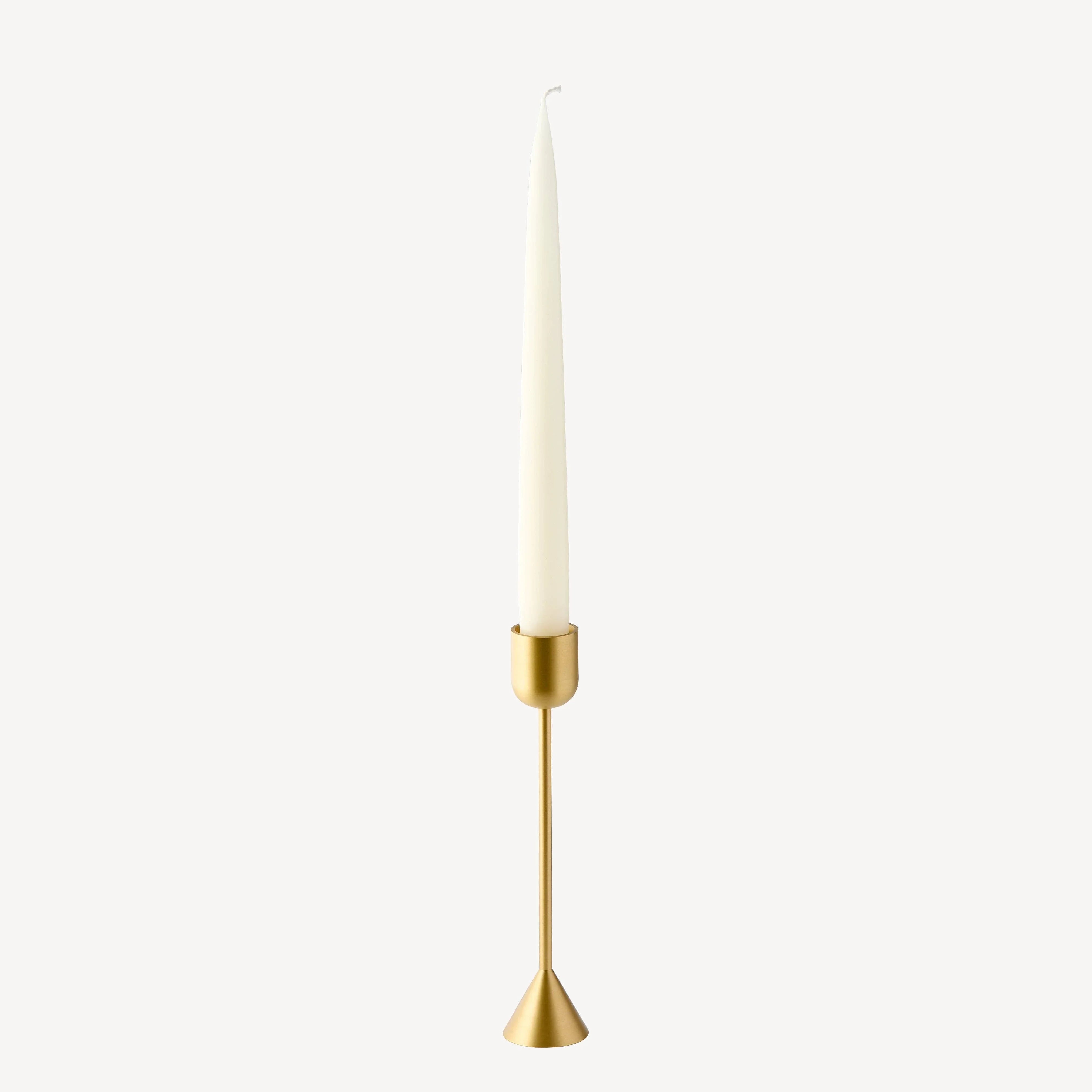 Ferm Living brass gold candle holder with white taper candle, minimalist design