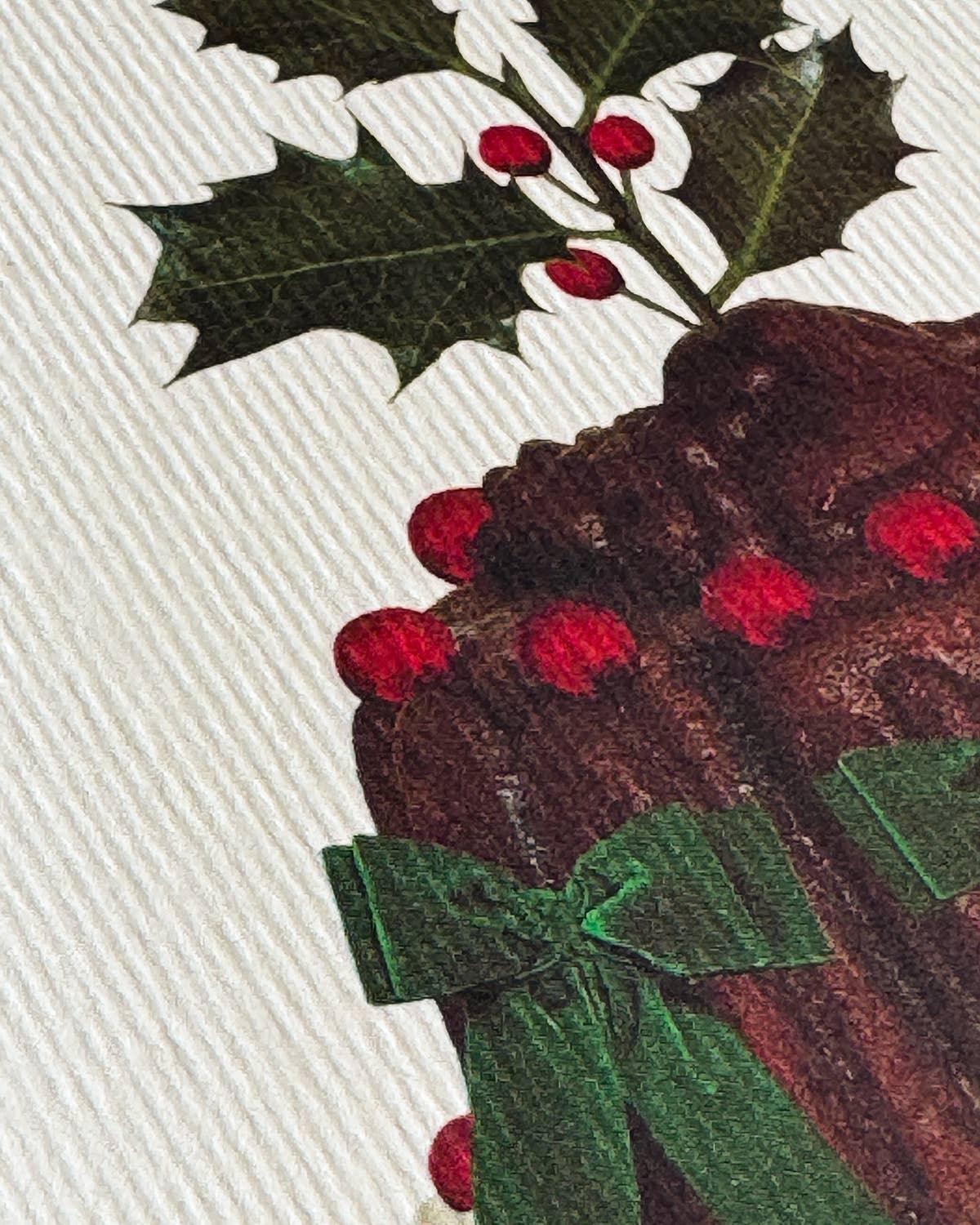 Christmas pudding print with holly leaves, red berries and green ribbon on textured card
