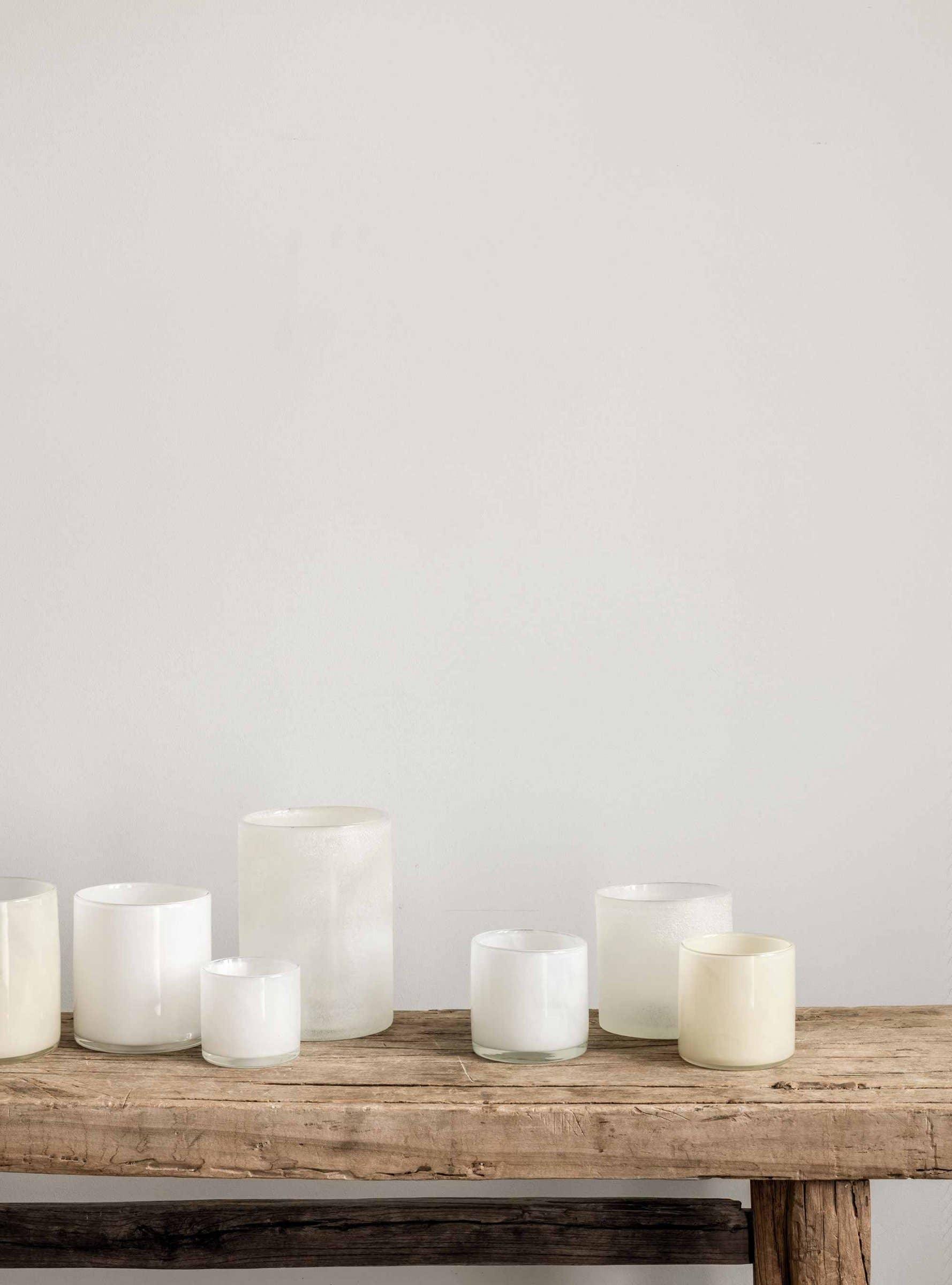 LO Studio glass candle holders white and cream on rustic wooden table
