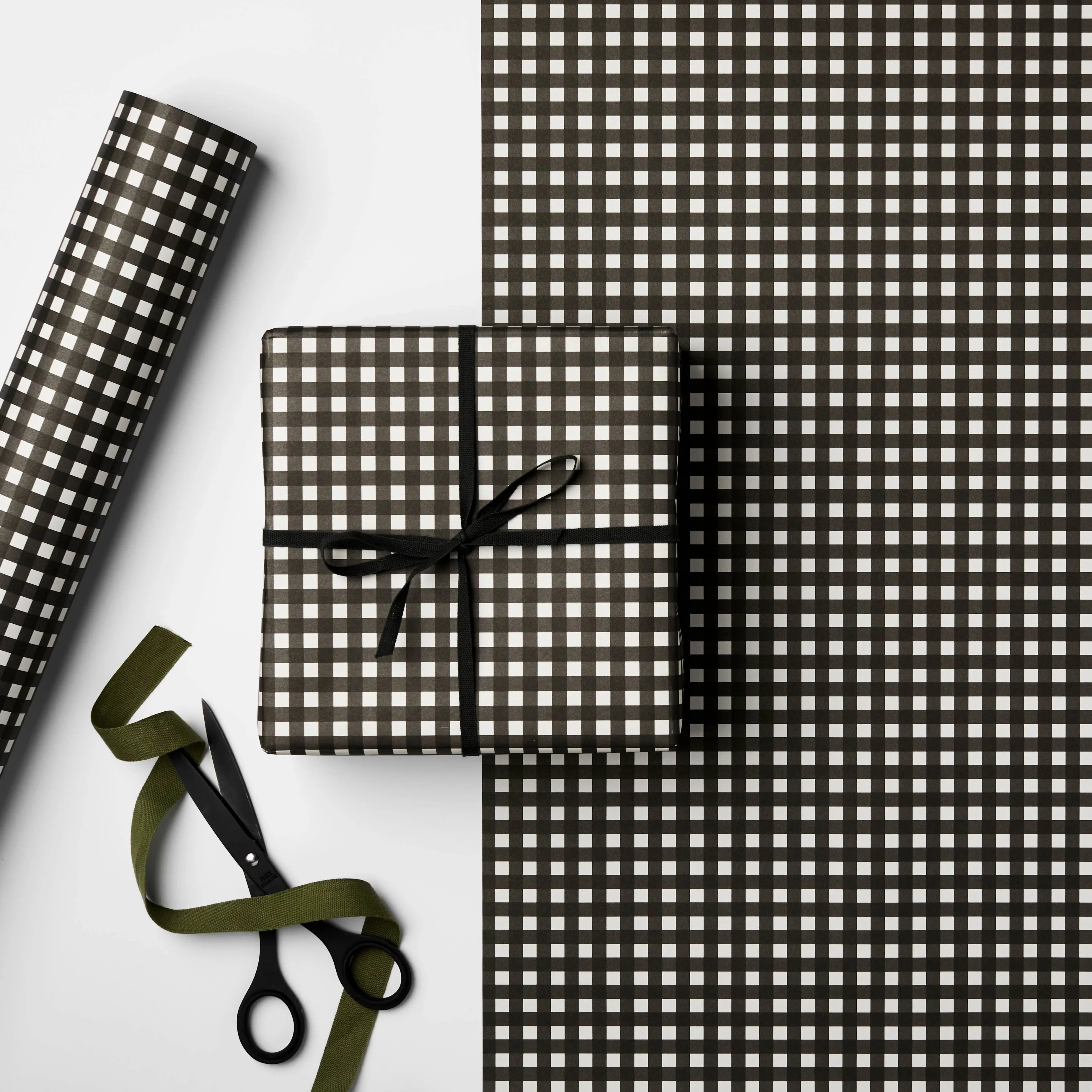 Rifle Paper Co. black and white checkered gift wrap paper with ribbon and scissors