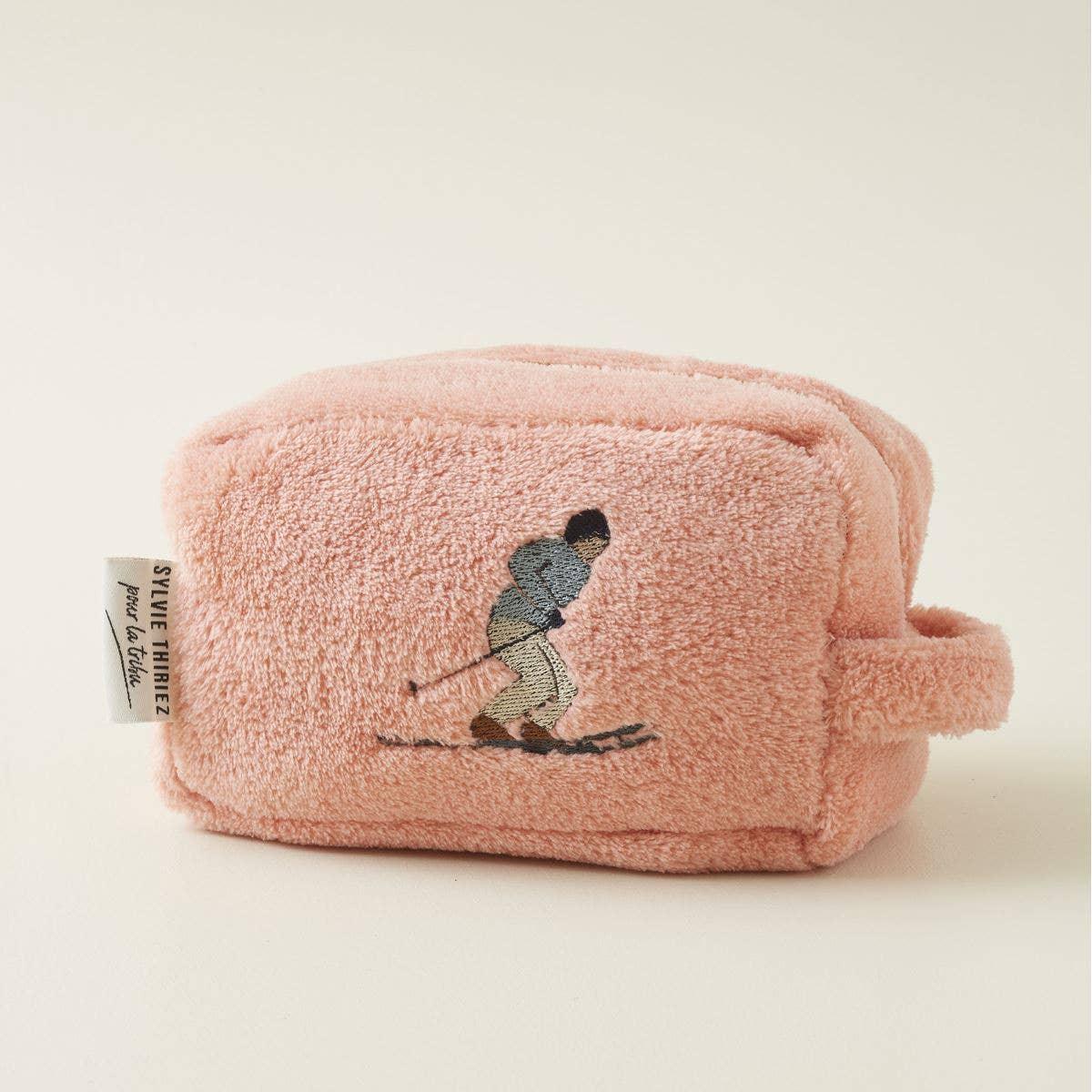 Sylvie Thiriez plush pink toiletry bag with skier embroidery, soft fleece fabric.