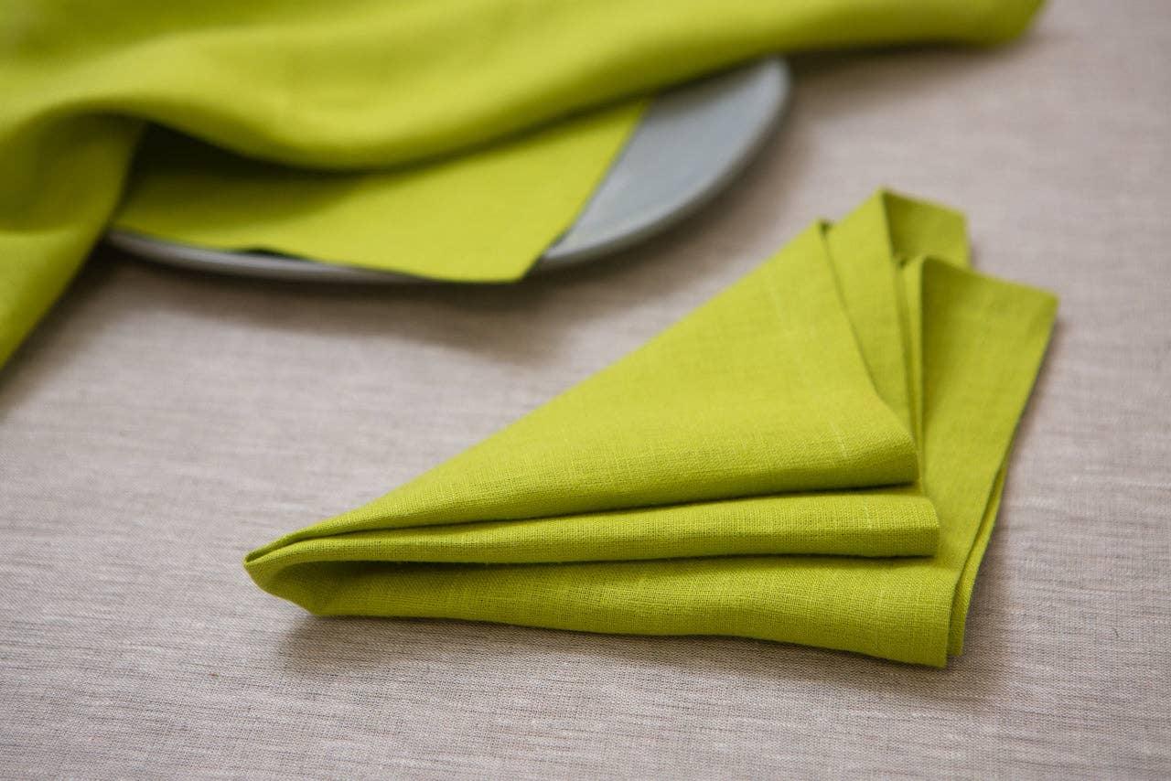 Linen Tales lime green linen napkin on neutral tablecloth, elegant table setting