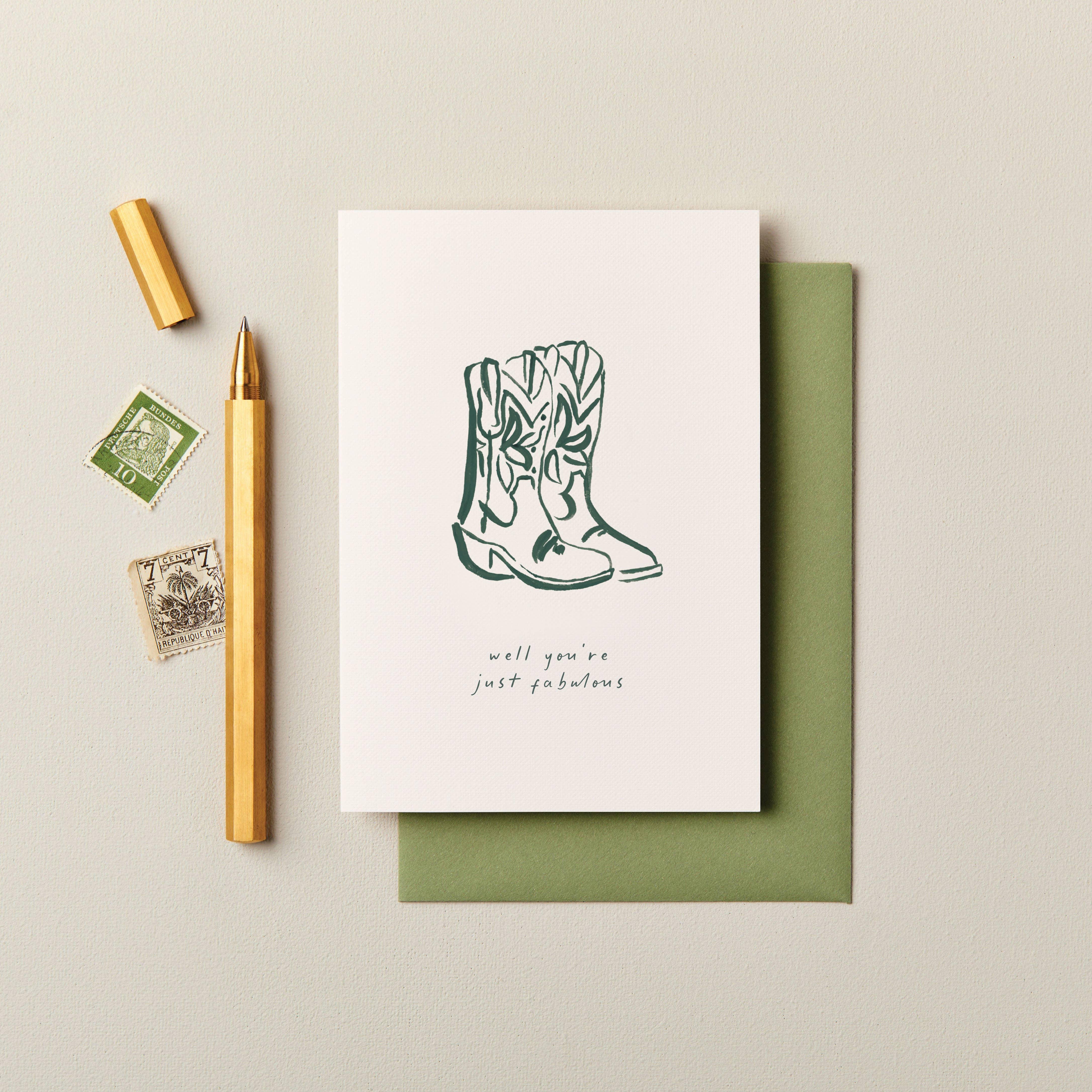 Apartment 2 Cards greeting card, white with green cowboy boots illustration and 'well you're just fabulous' text, paired with a green envelope.