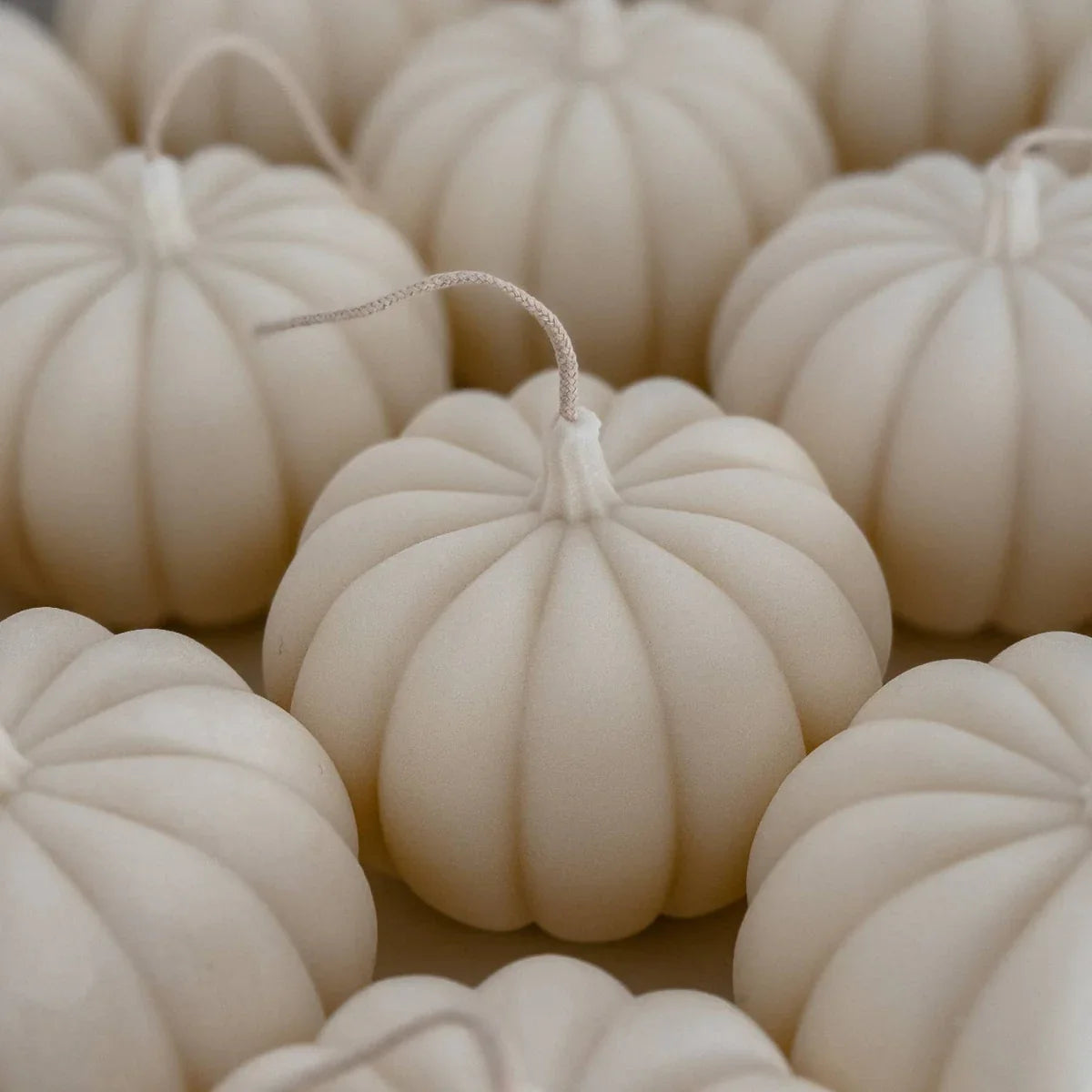 UNIQLY pumpkin-shaped soy wax candles in matte ivory, premium minimalist decor