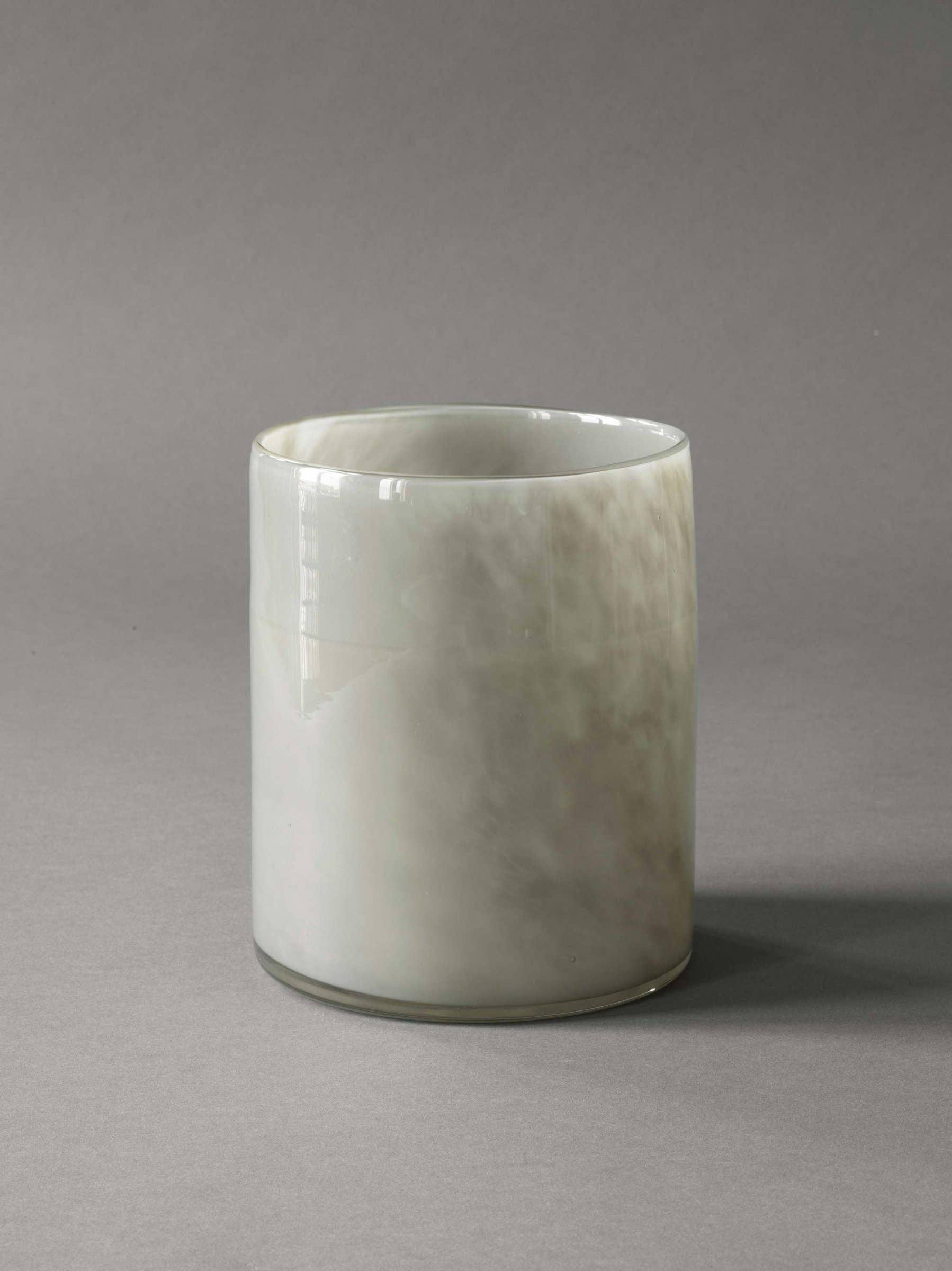 Tina Frey Designs white resin tumbler with smooth, glossy finish on grey background
