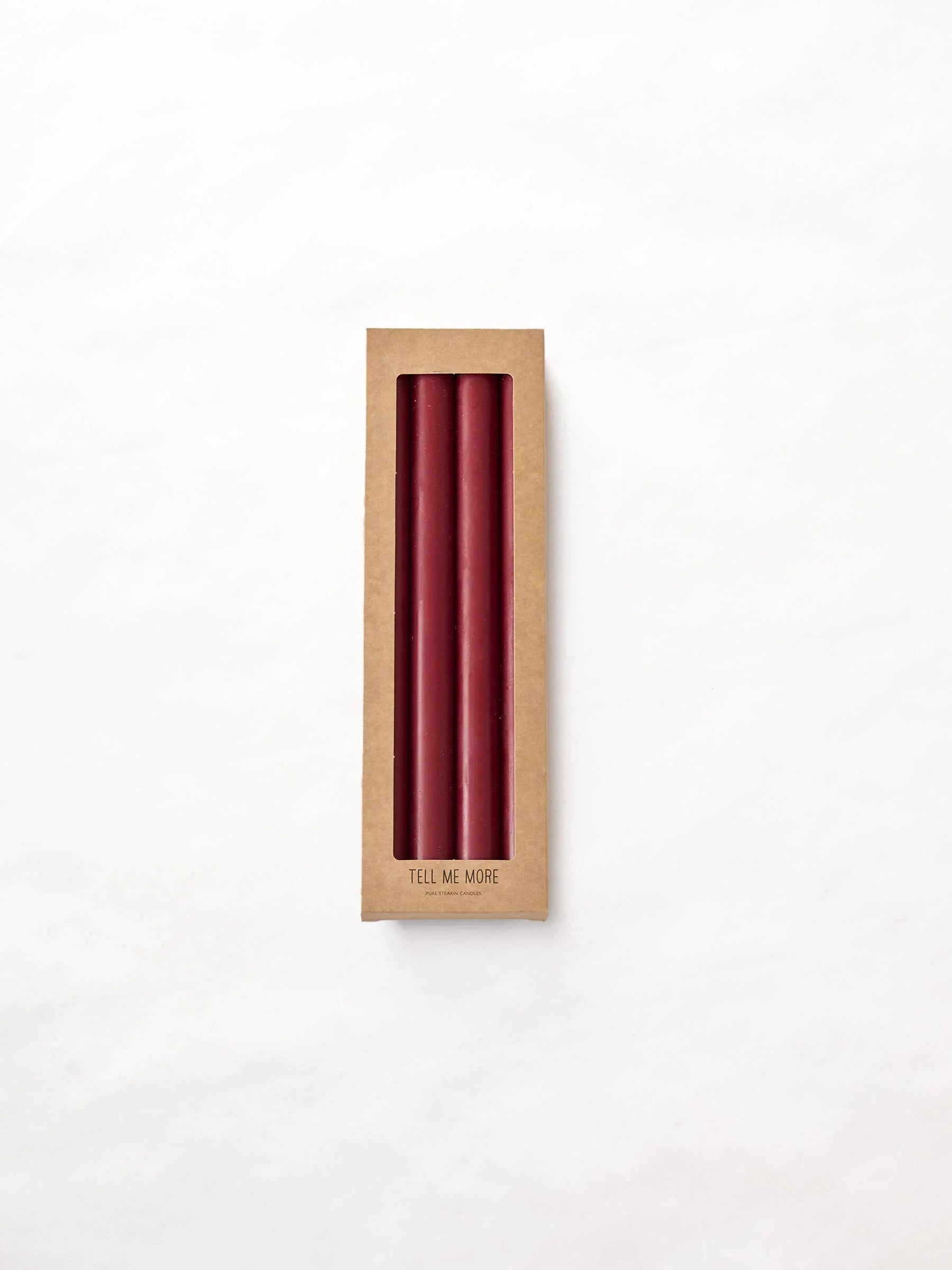 Tell Me More burgundy taper candles in a brown cardboard box, premium wax candles