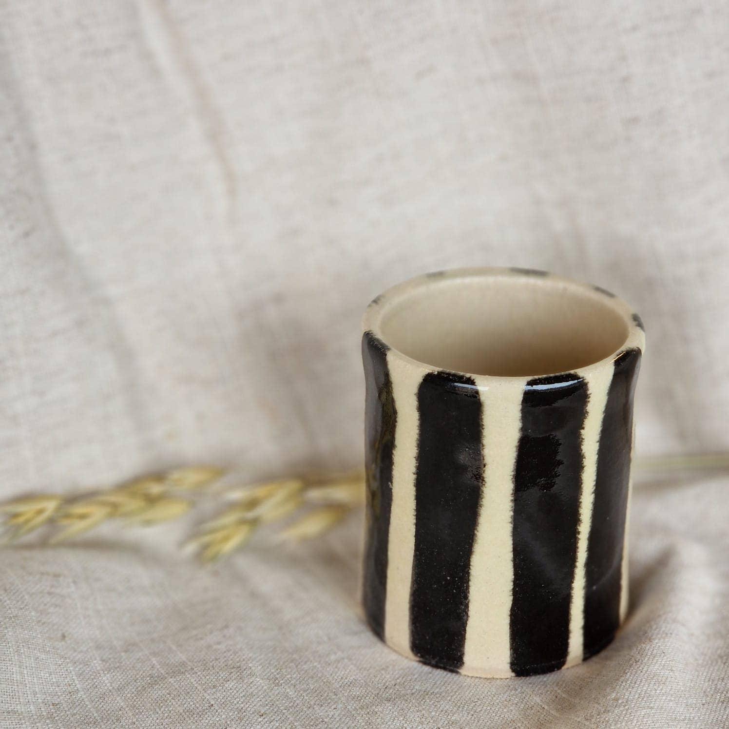 Yield striped ceramic cup, handmade stoneware, black and cream glaze, minimalist design