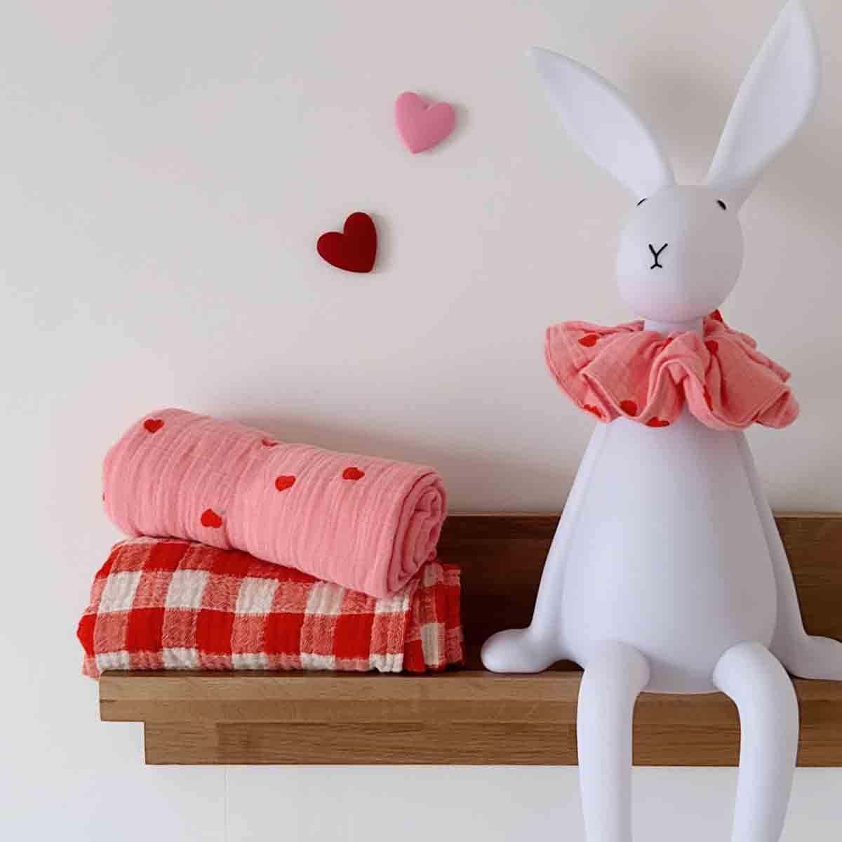 Maison Deux rabbit lamp with pink cotton heart scarf, checkered and heart-print blankets