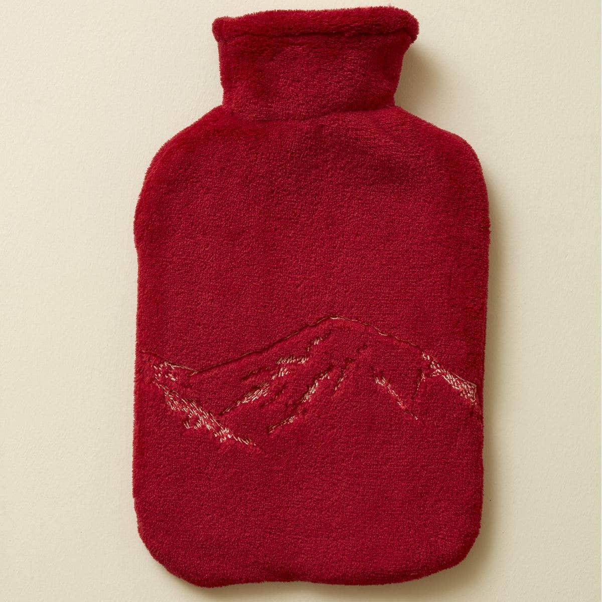 YuYu hot water bottle with red fleece cover and embroidered mountain design