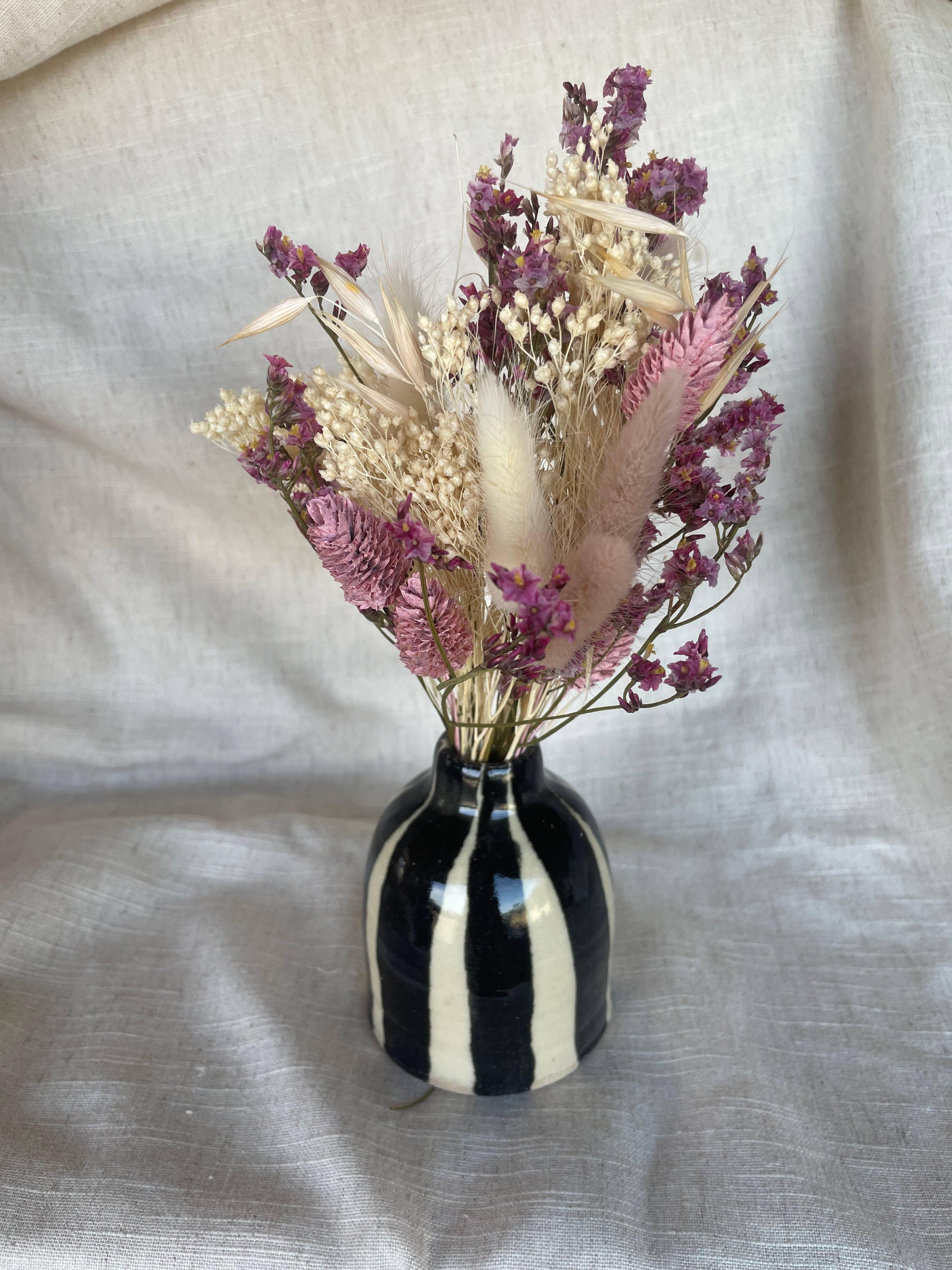 Studio Pez black and white ceramic vase with natural and purple dried flowers