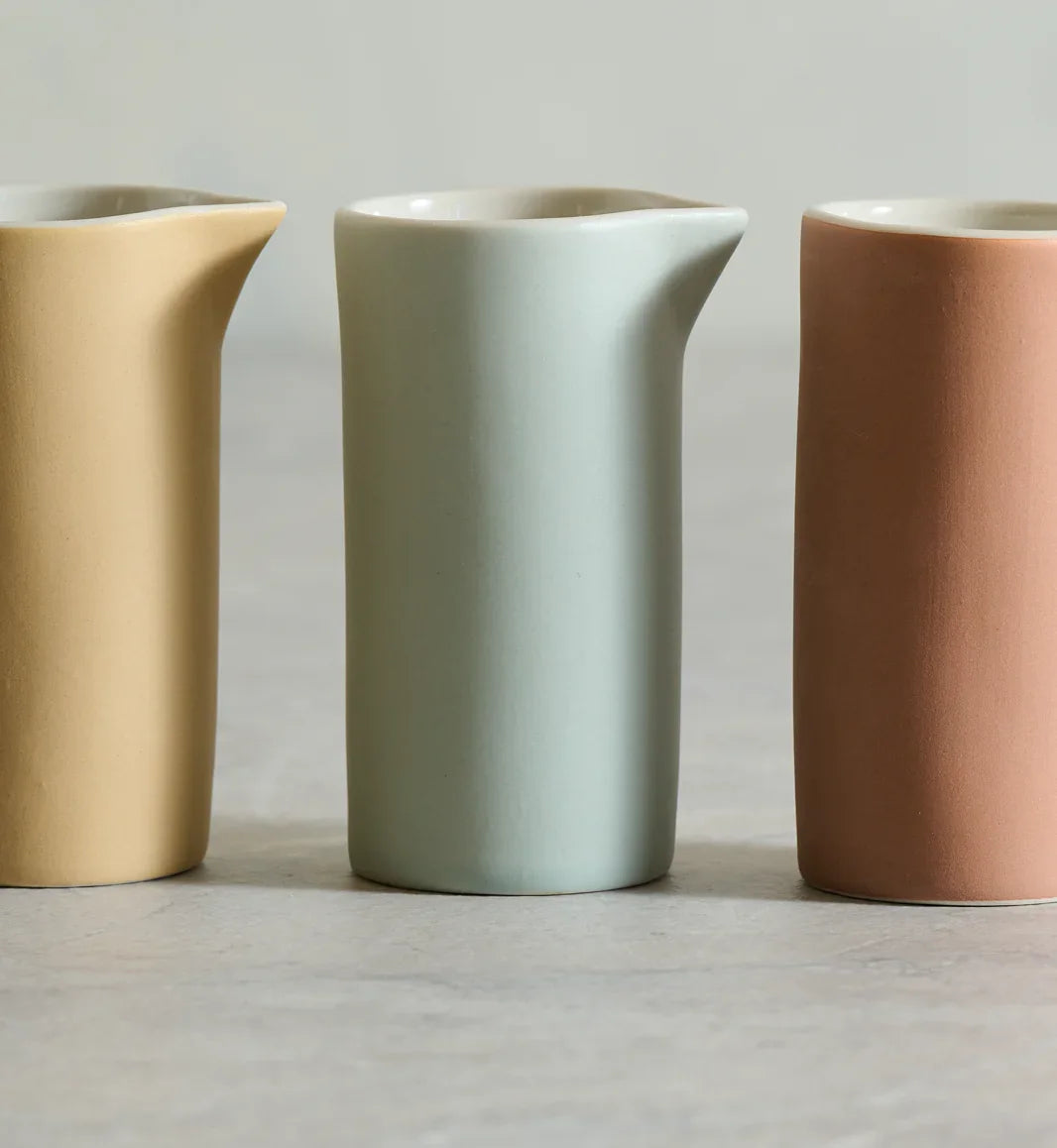 Hasami ceramic pitchers in beige, light blue and terracotta, matte finish, minimalist design
