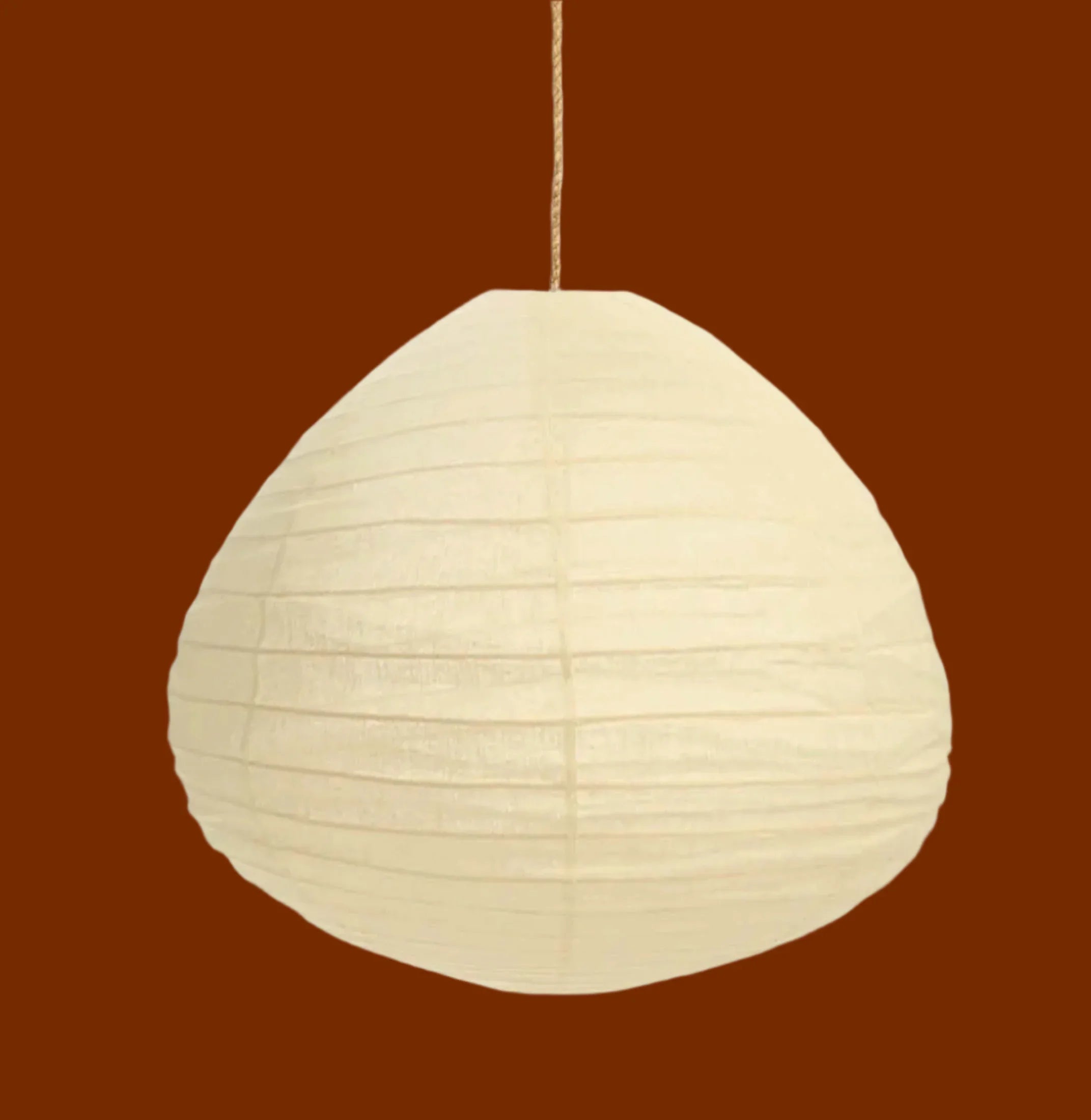 Mojave pendant lamp, cream rice paper shade, minimalist design, brown background