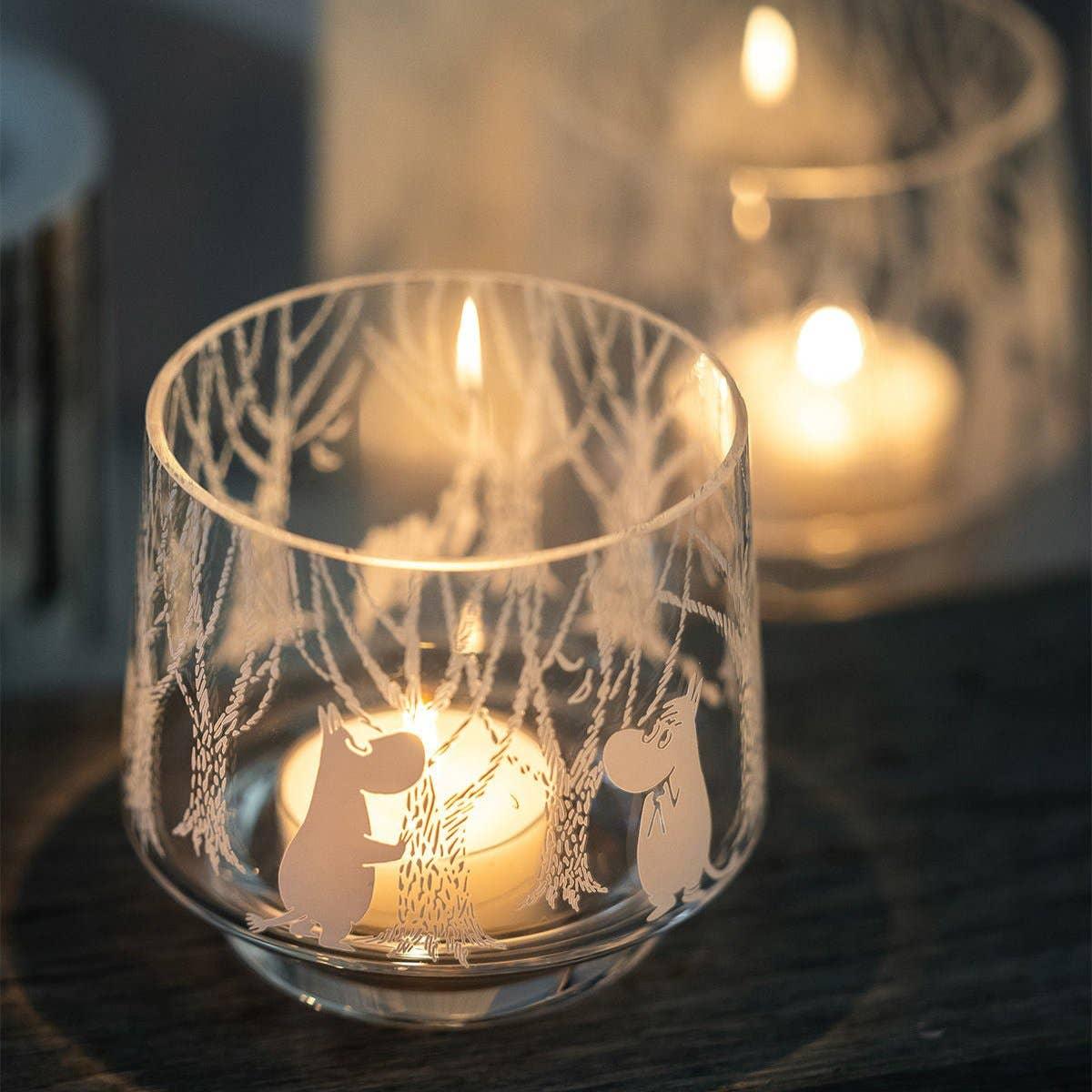 Iittala Moomin glass candle holder with clear etched woodland design and tealight candle