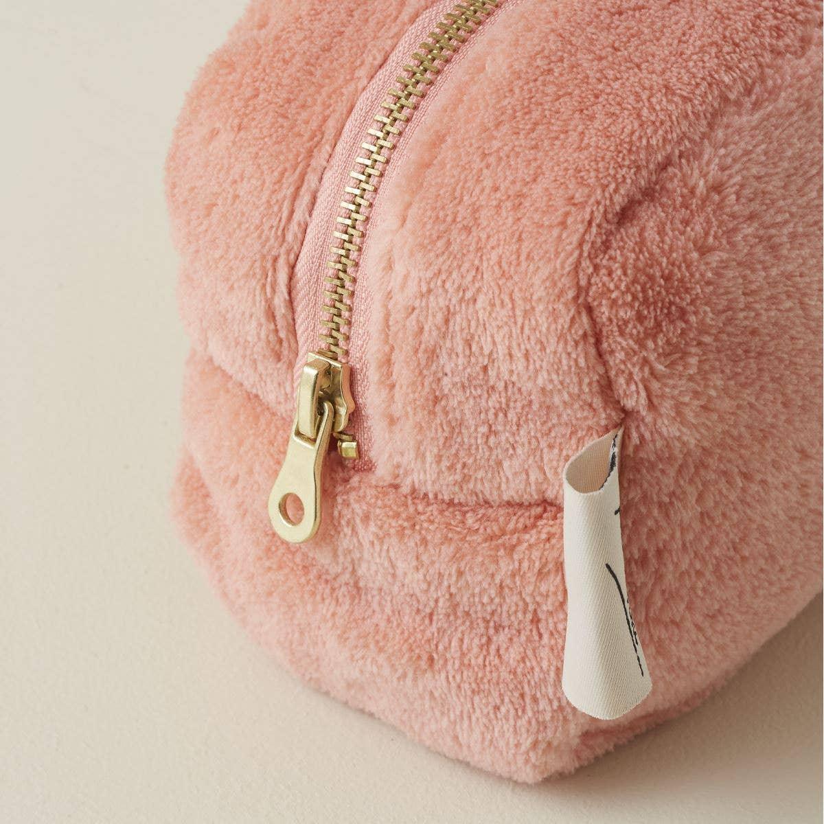 Baggu pink fuzzy zip pouch, plush fabric, gold zipper, premium finish