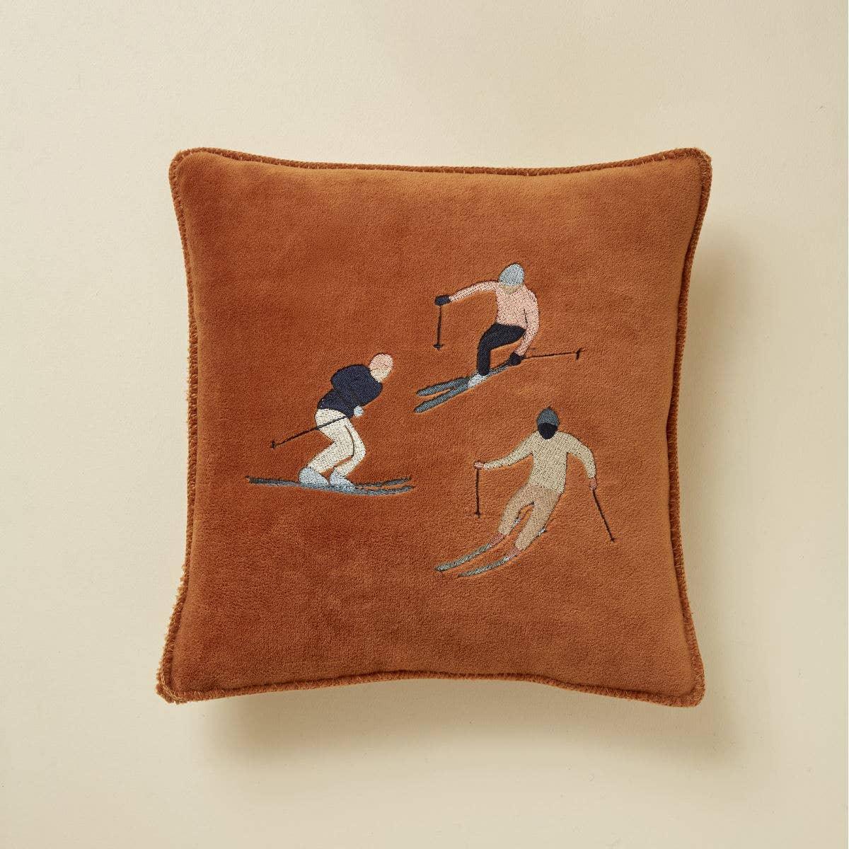 ChappyWrap brown decorative pillow with embroidered skiers, premium plush fabric