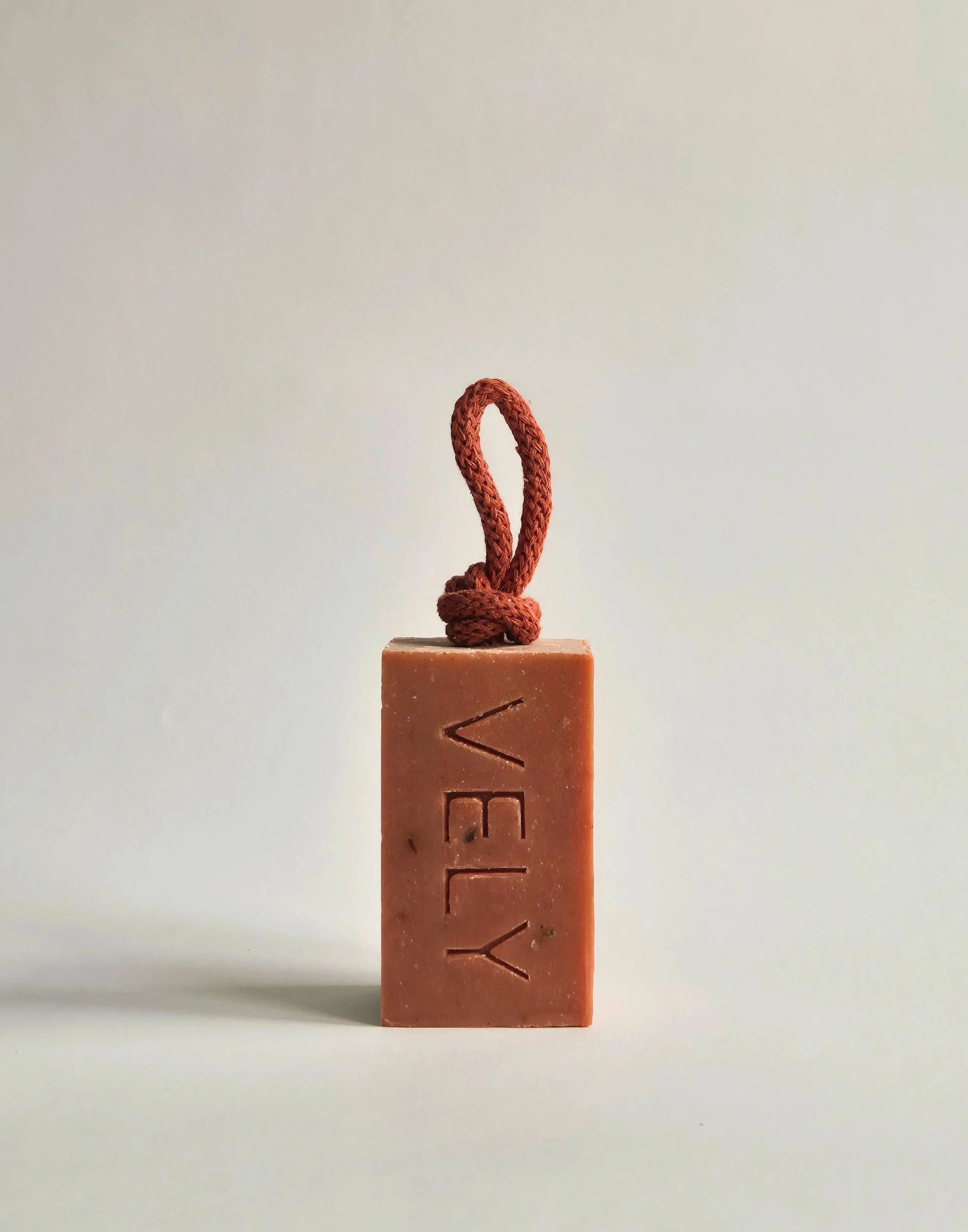 VELY artisan soap bar, natural ingredients, terracotta color, with braided hanging rope