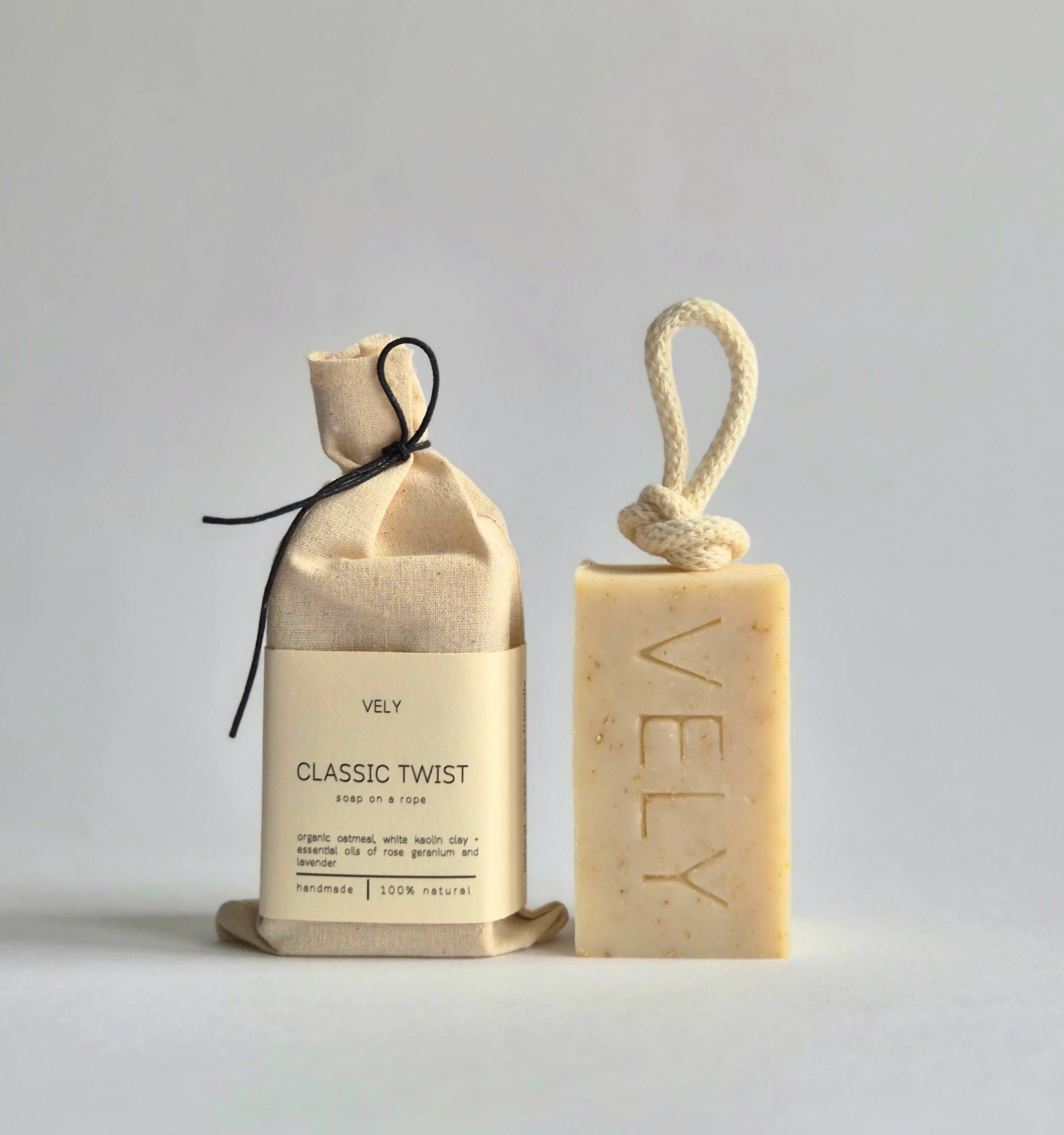 VELY Classic Twist oatmeal soap on a rope with cotton pouch, natural beige color