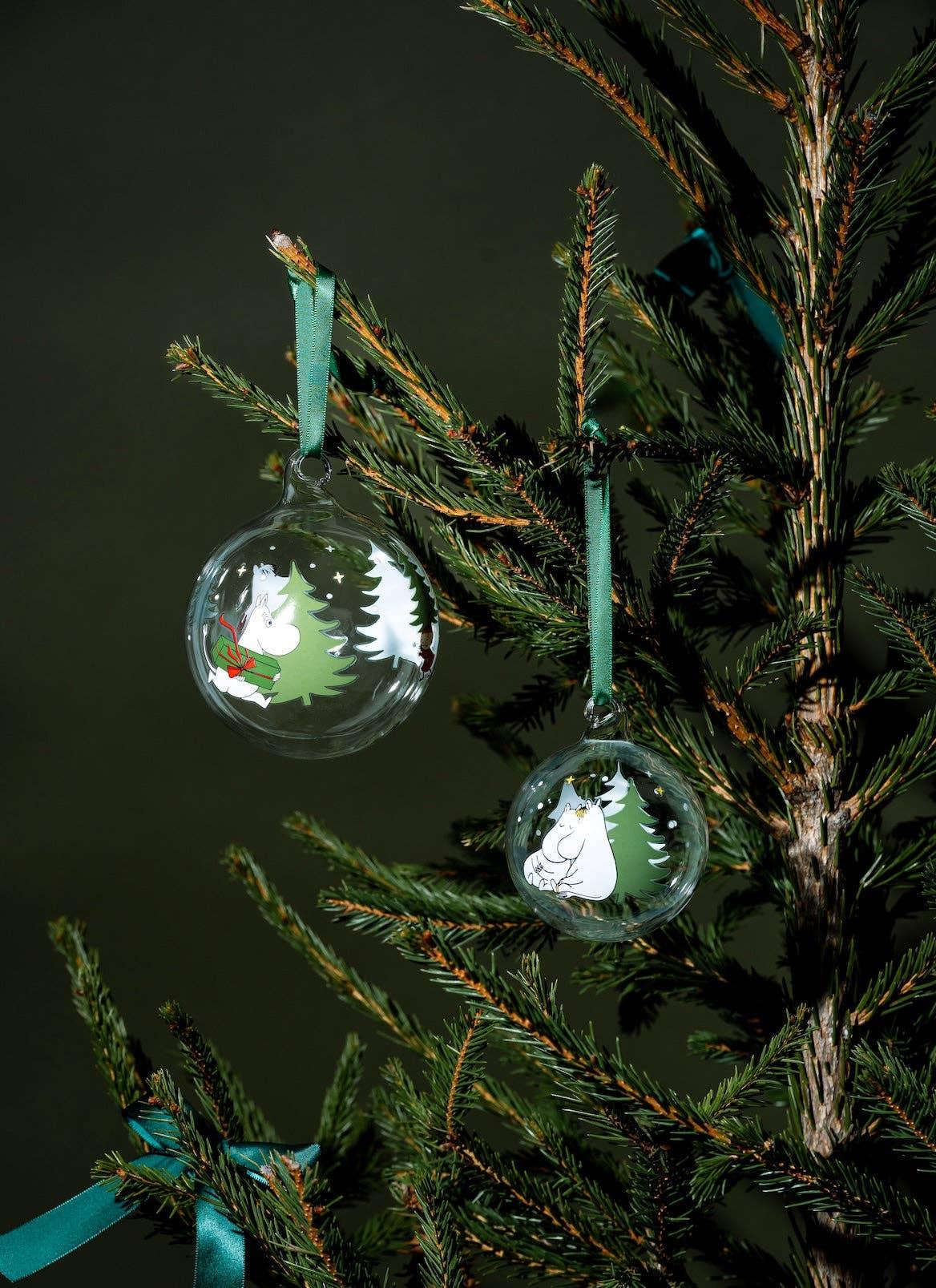 Nordicbuddies Moomin glass baubles with green ribbon on pine Christmas tree