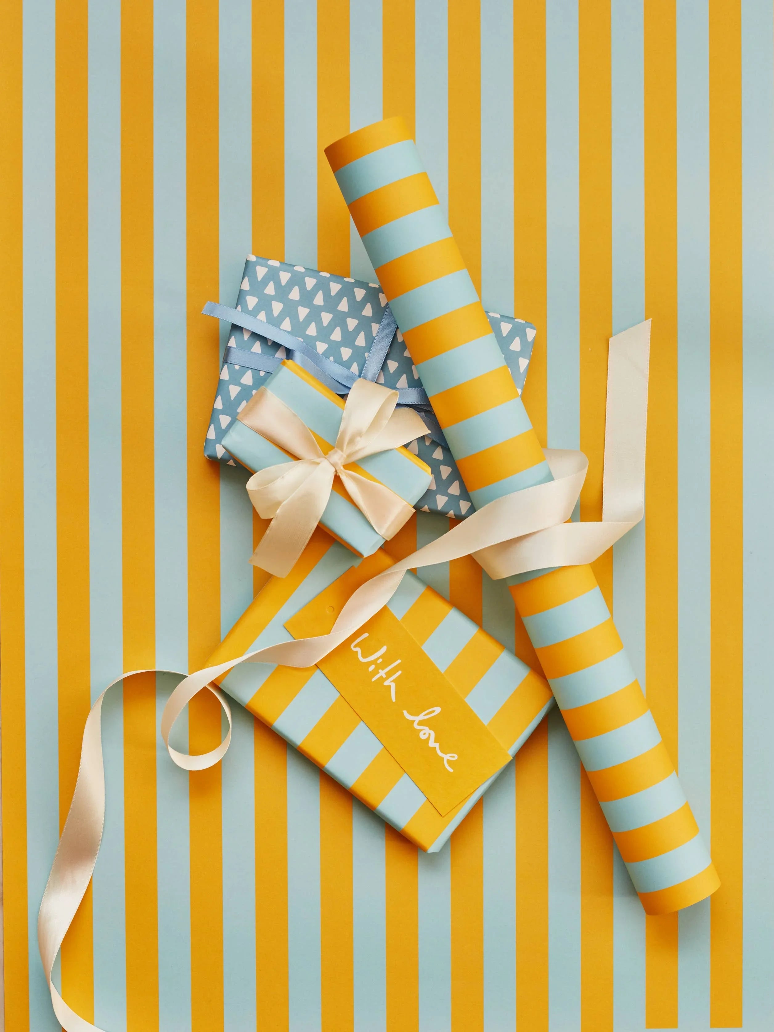 Rifle Paper Co. premium gift wrap and boxes, striped blue and yellow paper, satin ribbon