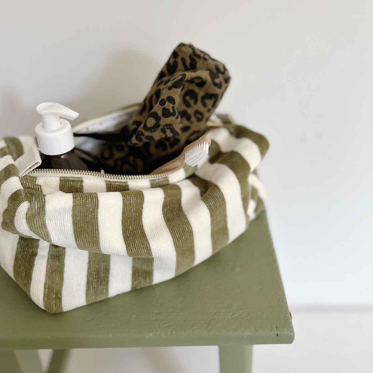 Helen Round striped green corduroy makeup bag with leopard print pouch and lotion bottle