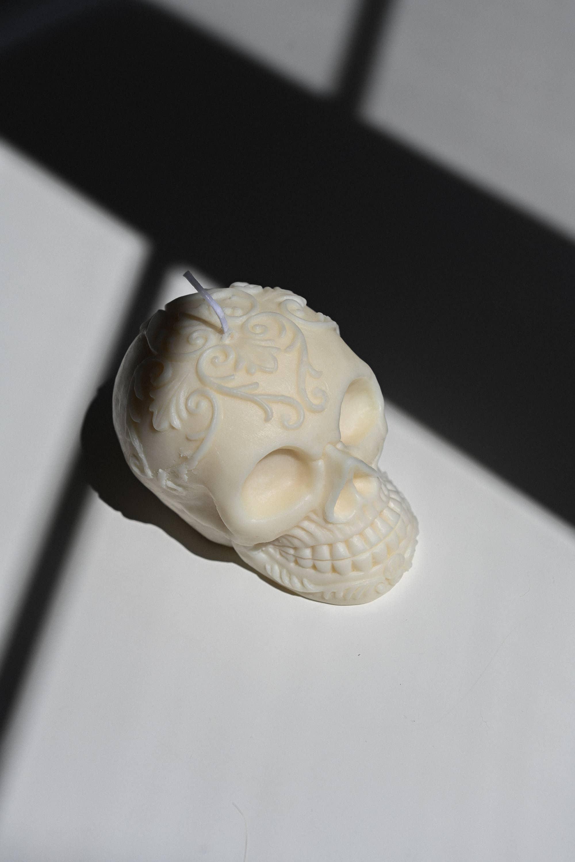 Nata Concept Store skull-shaped white soy wax candle with embossed floral details