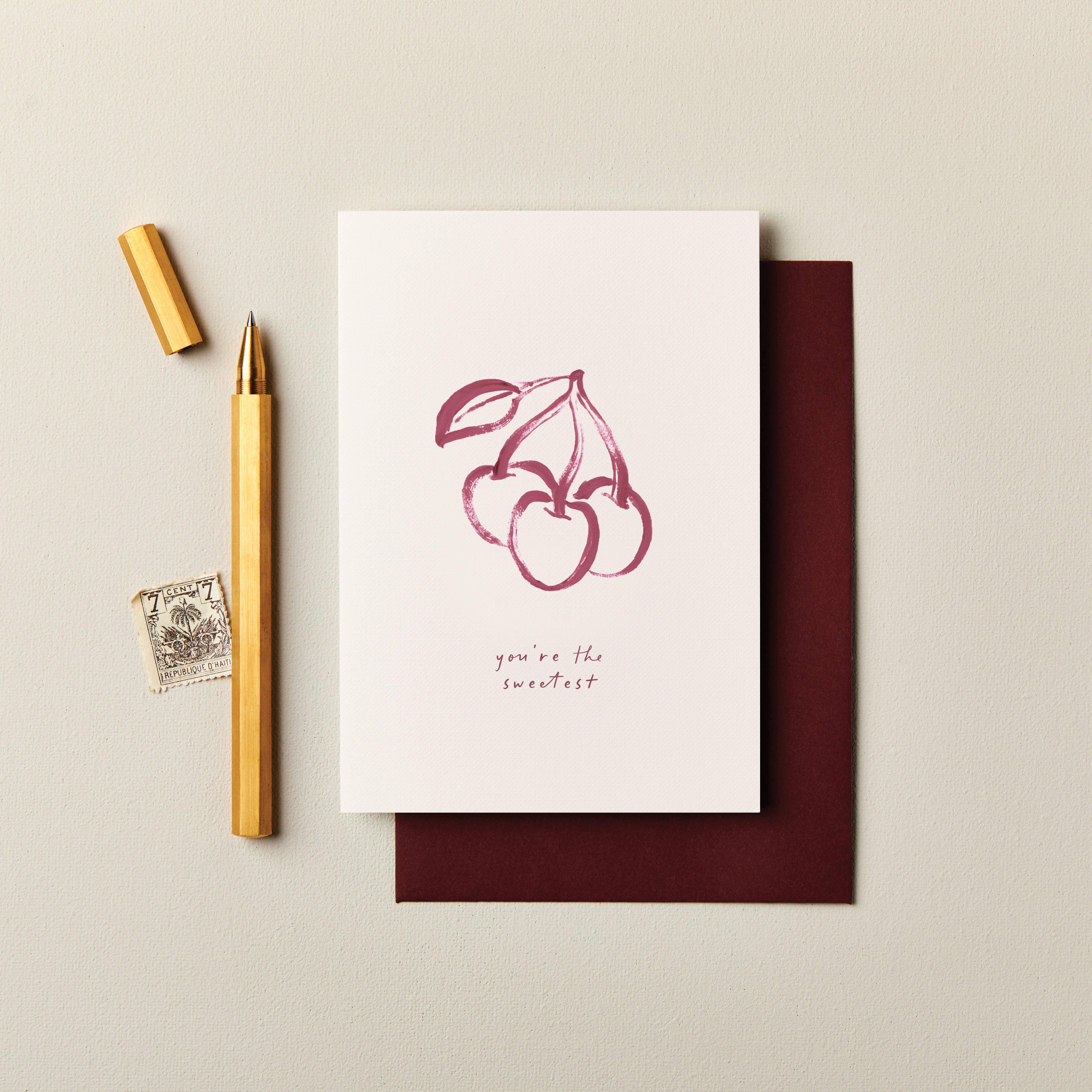 Sweet Pea Paper cherry greeting card with burgundy envelope, premium textured paper