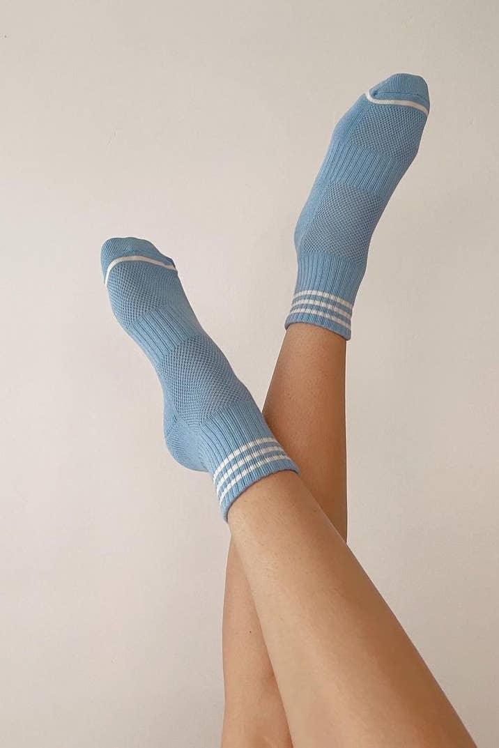Le Bon Shoppe blue cotton crew socks with white stripes on feet, minimal background