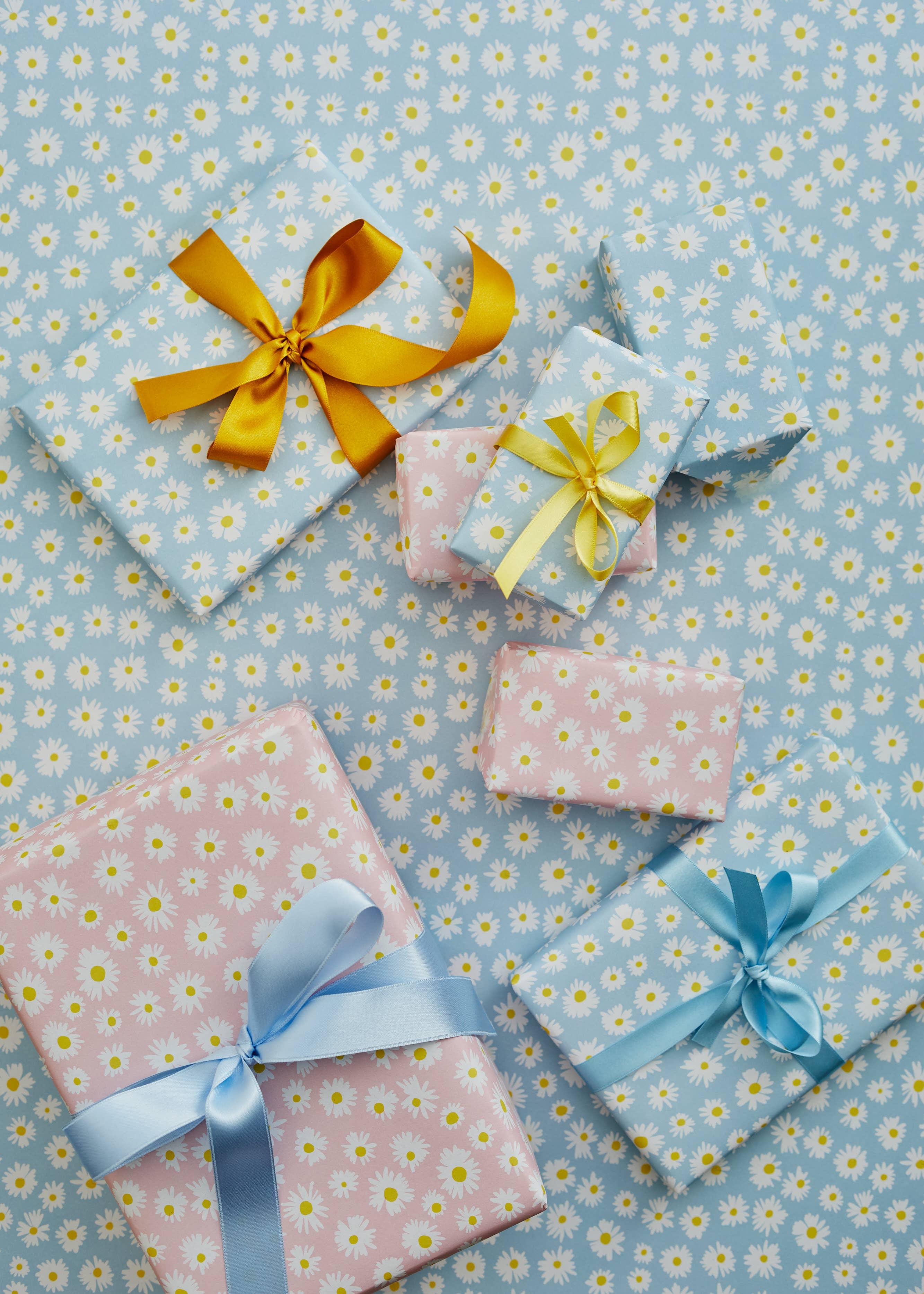 Papier gift wrap sets, daisy floral paper, satin ribbons in blue, yellow, pastel colors