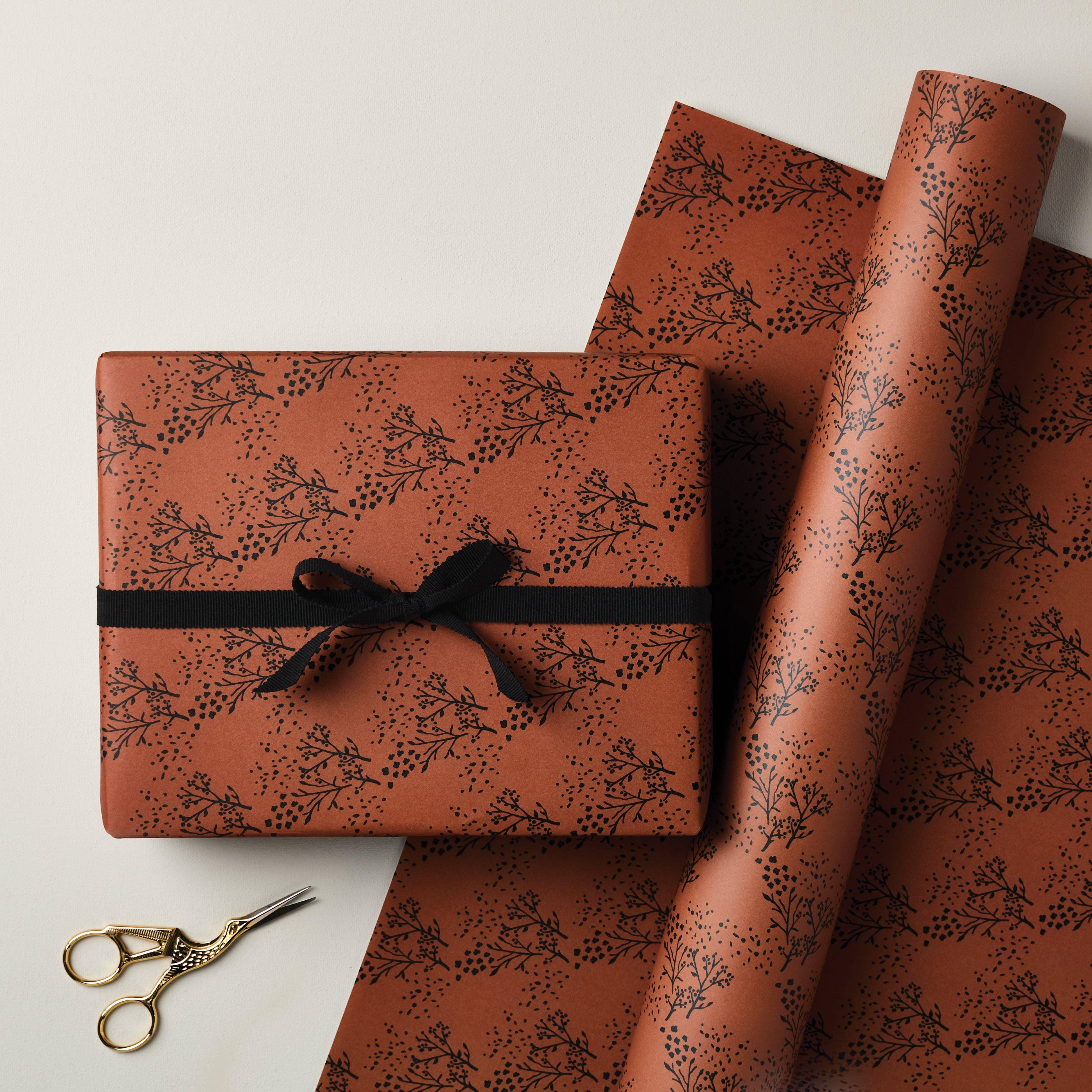 Beshlie McKelvie brown botanical wrapping paper, premium matte finish, black ribbon accent