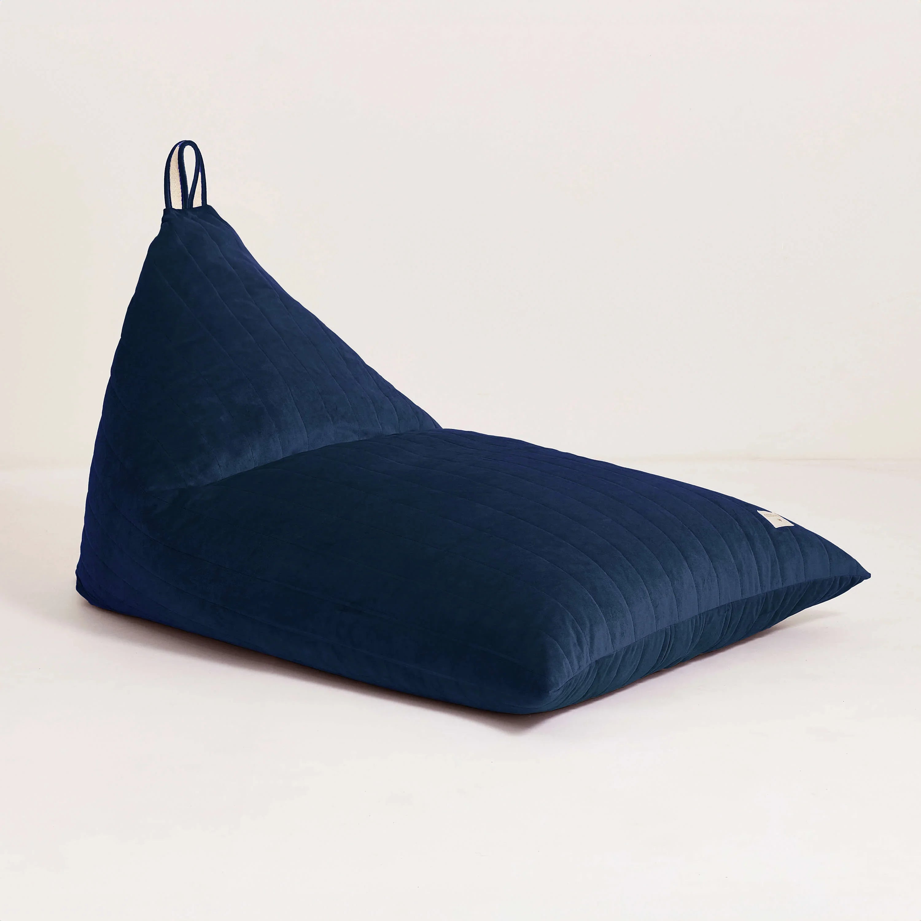 Nobodinoz Essaouira bean bag in premium night blue velvet on white background
