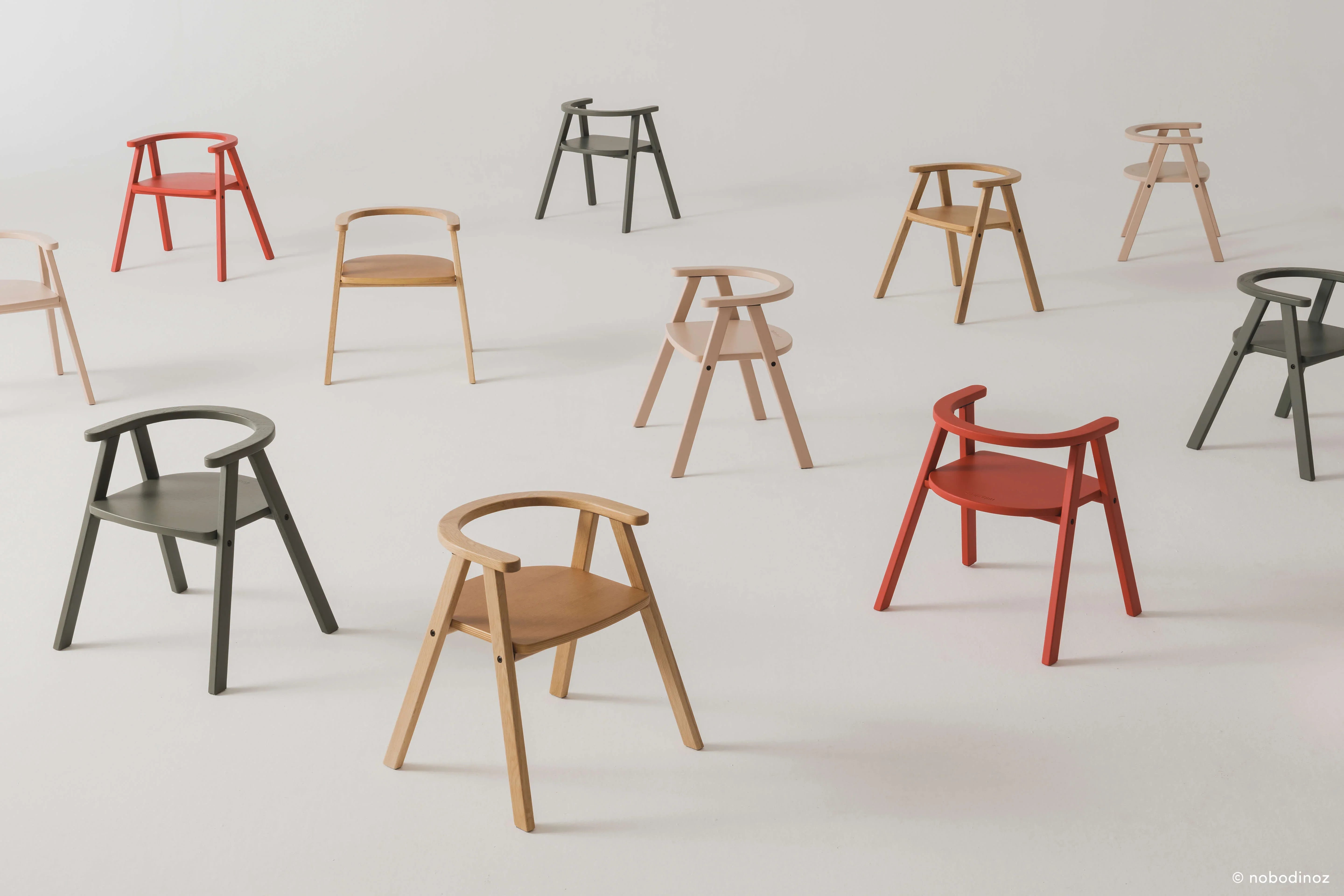 Nobodinoz Growing Green kid tables, natural oak, in light wood, red, and green tones on white.