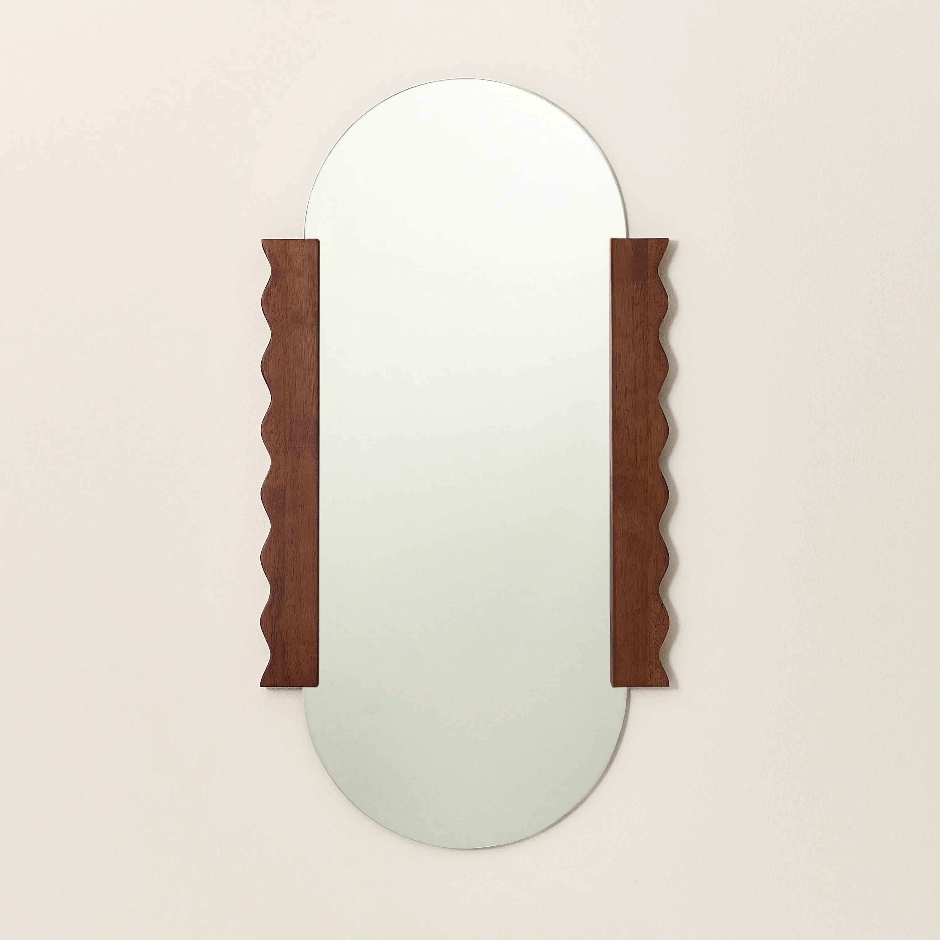 Heju x Nobodinoz mirror with oval glass and walnut wood wavy side panels, wall-mounted
