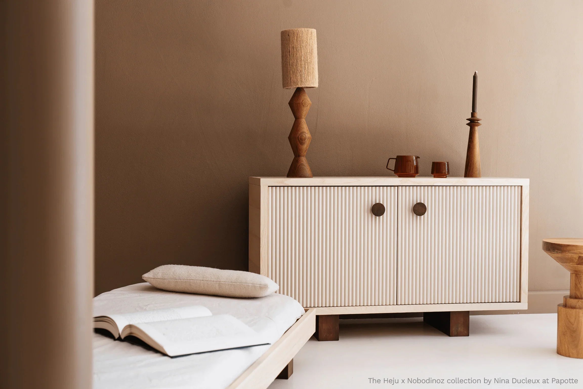 Heju x Nobodinoz wooden sideboard in light beige with fluted doors in a modern room