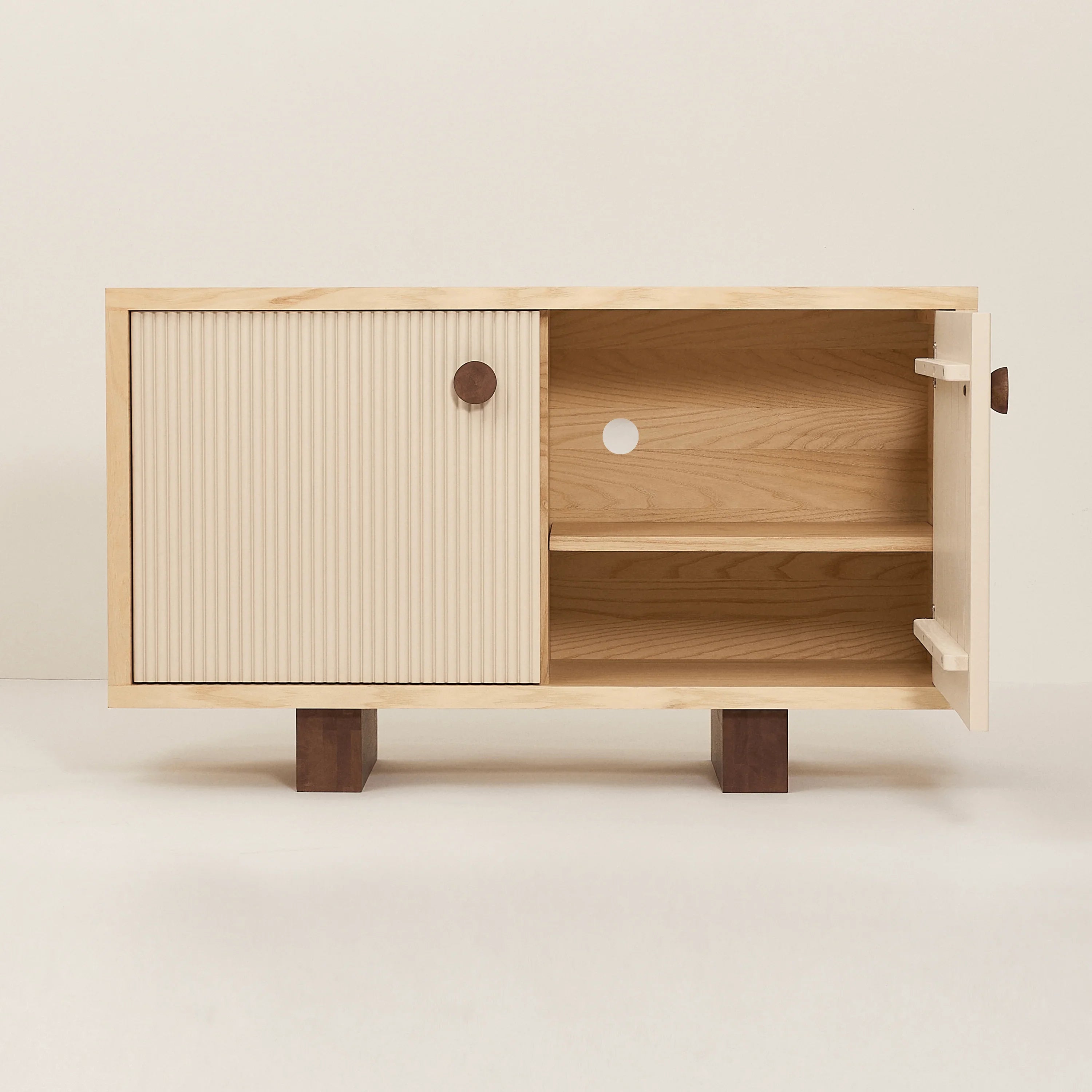 Heju x Nobodinoz wooden sideboard with ribbed cream door and walnut accent legs