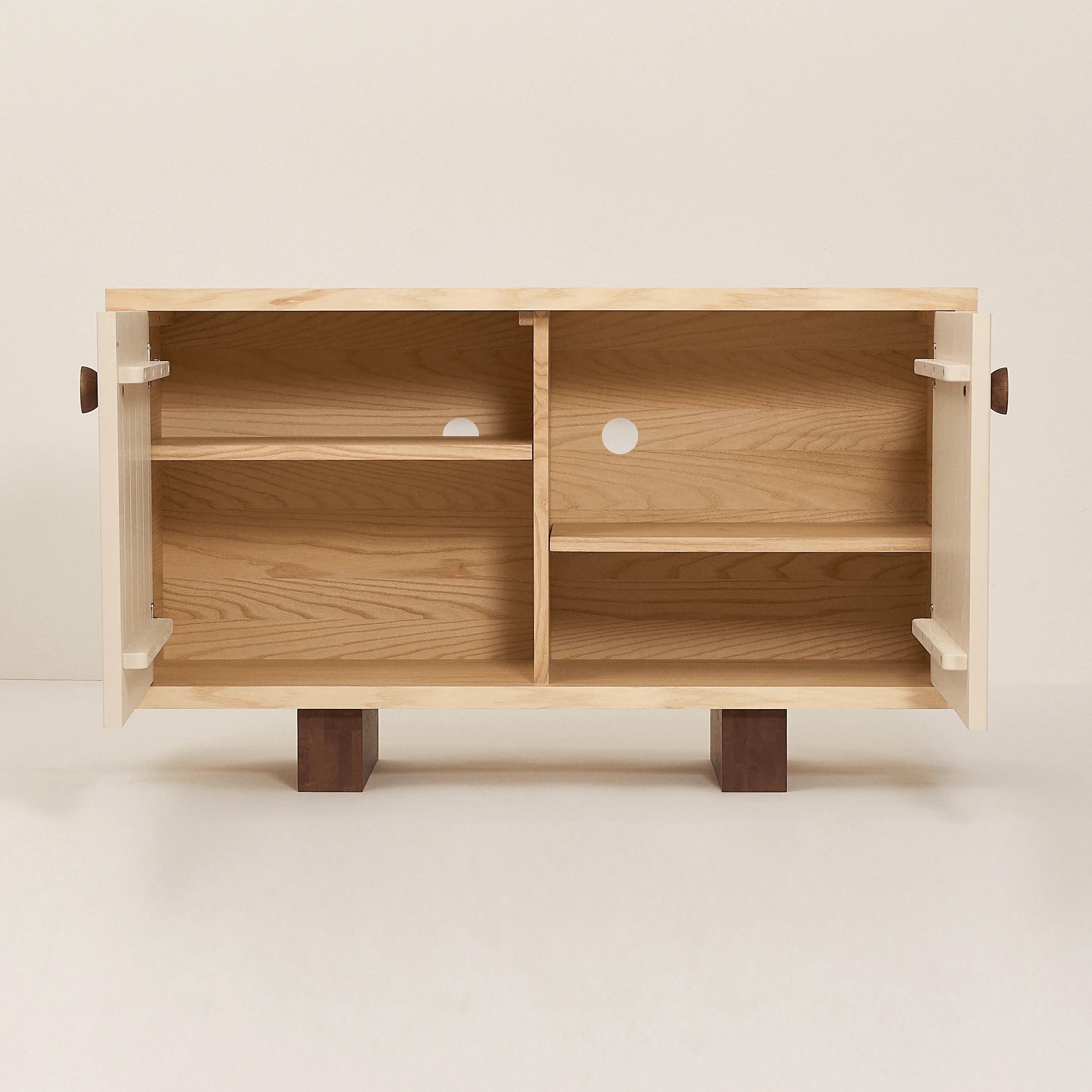 Heju x Nobodinoz light wood sideboard with open doors, shelves, and minimalist design