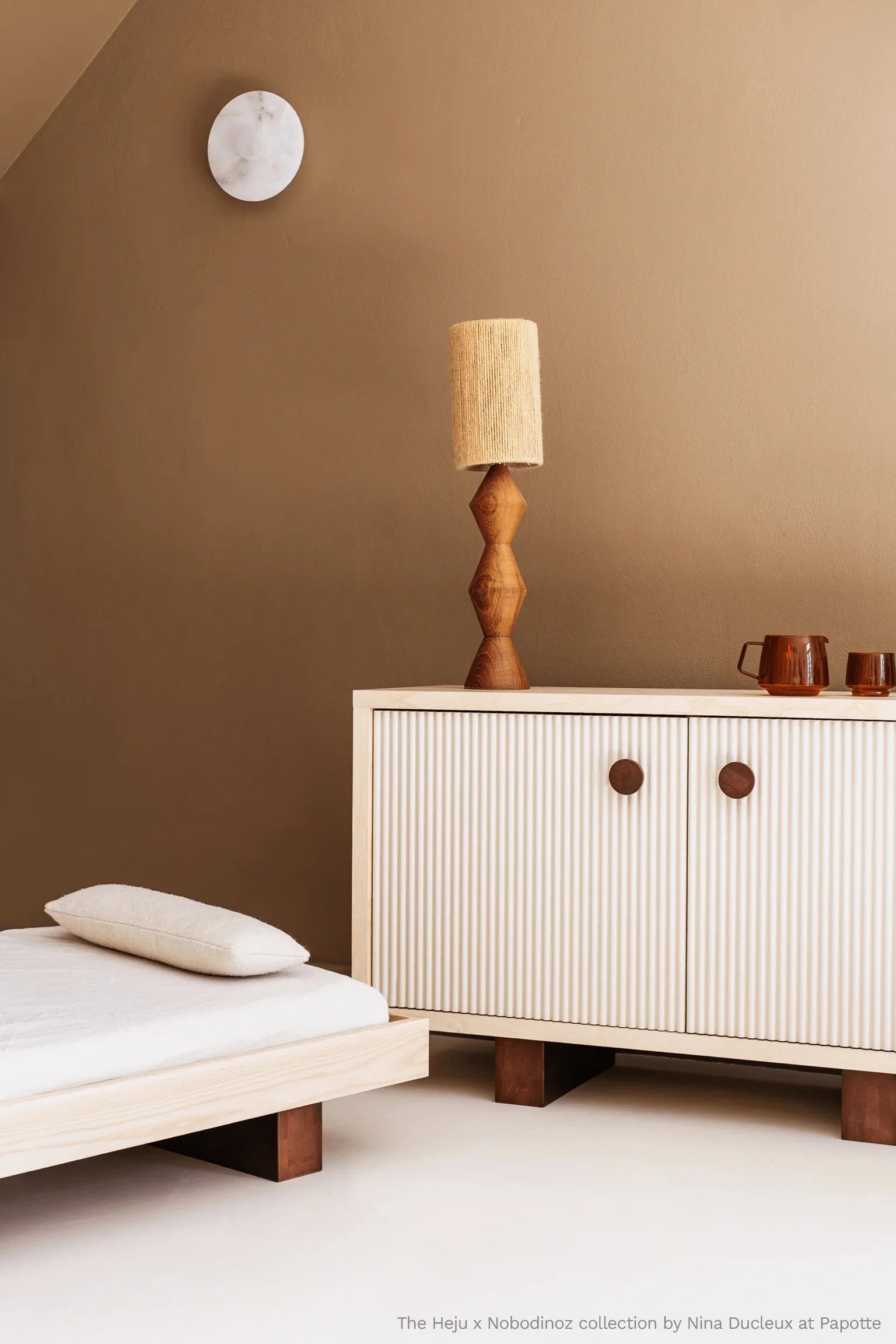 Heju x Nobodinoz sideboard in light wood with ribbed doors and brown accents, modern decor