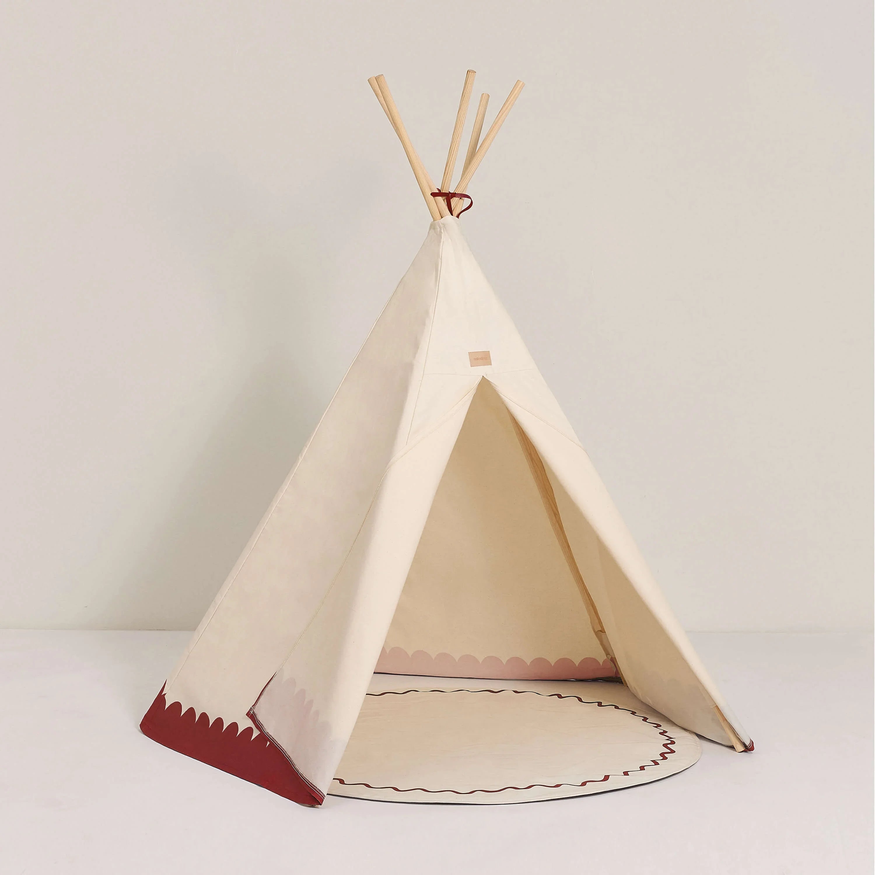 Nobodinoz Arizona teepee, cream canvas with carmine trim, wooden poles, kids play tent