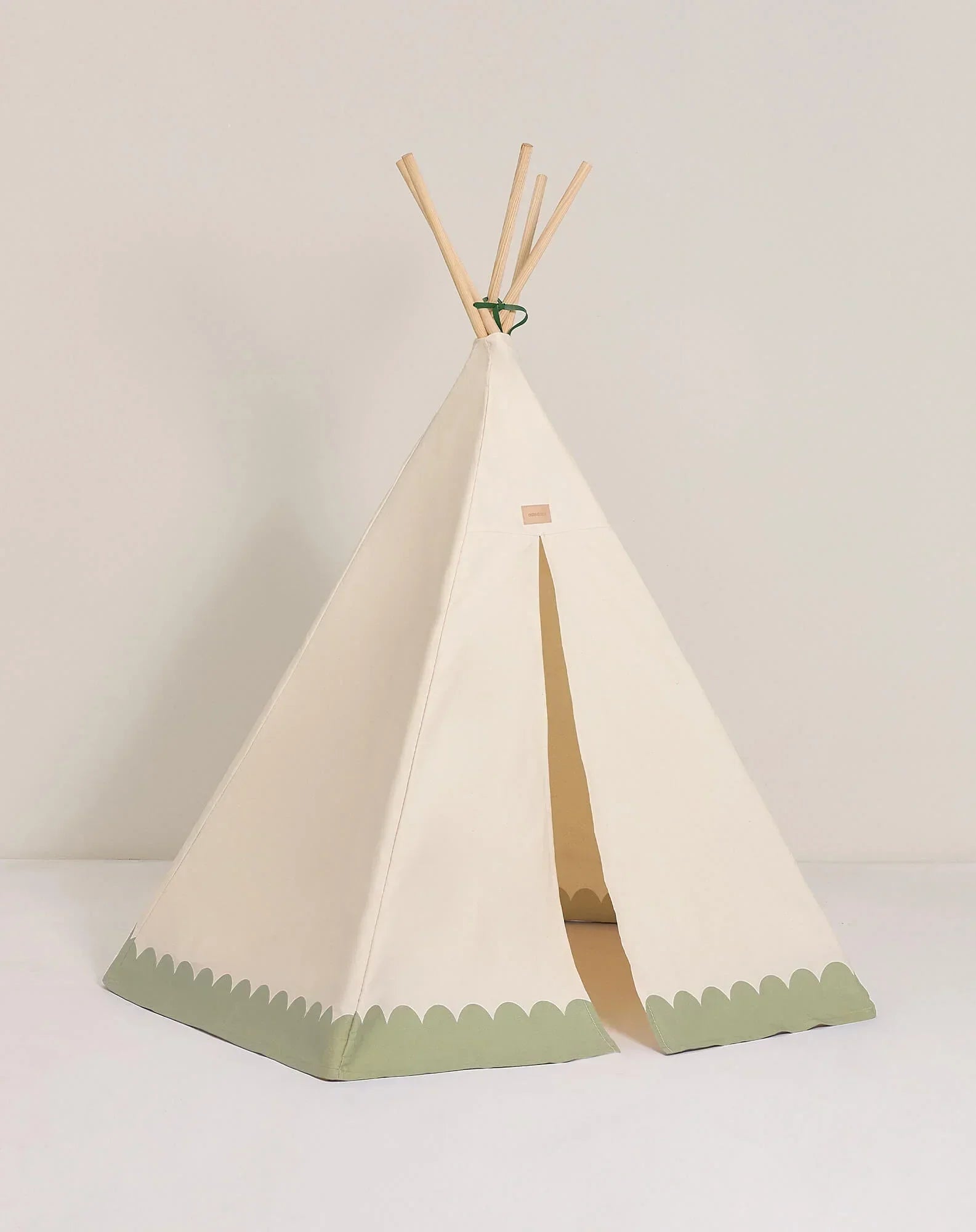 Nobodinoz Arizona teepee tent in organic cotton, beige with green trim, wooden poles