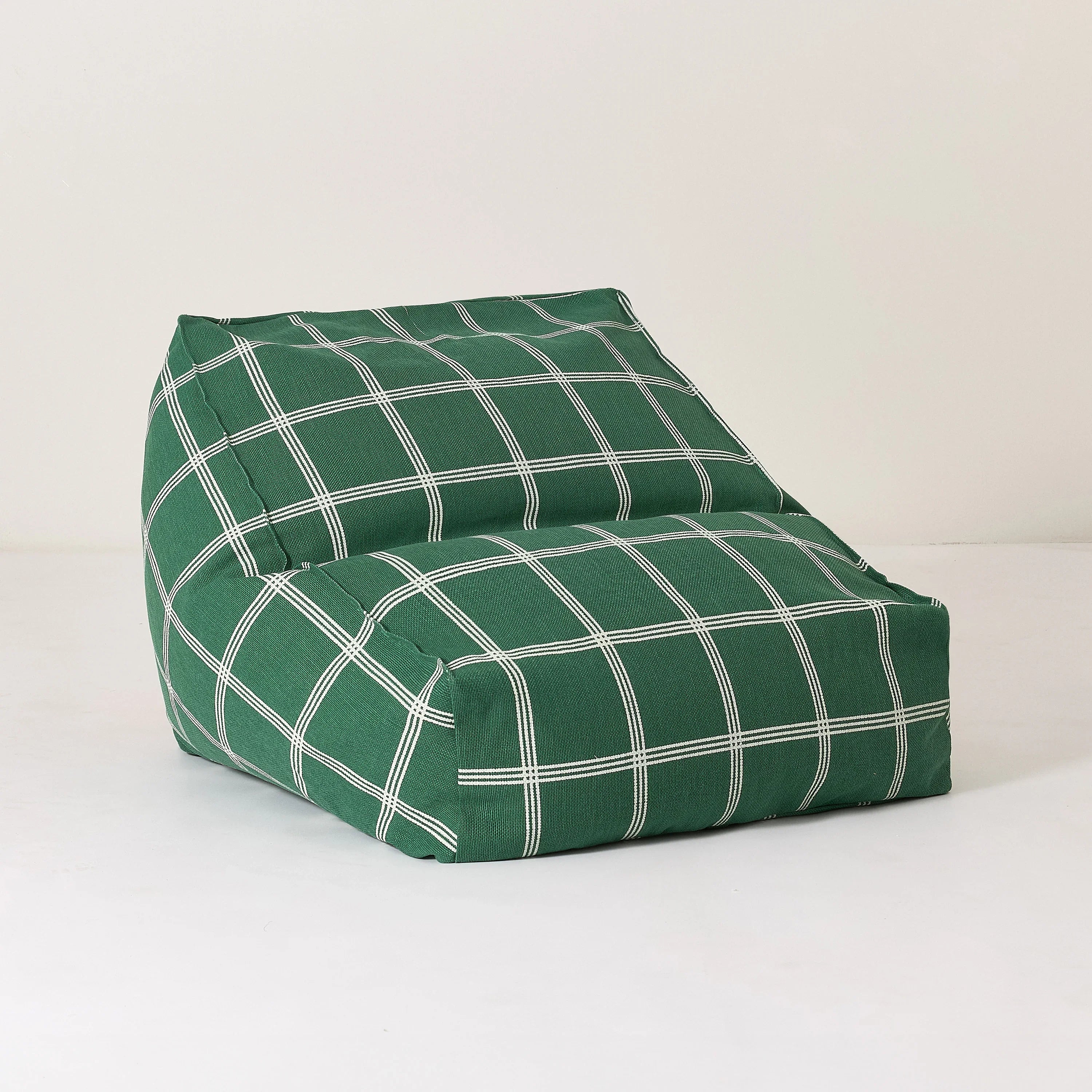 Nobodinoz green armchair bean bag with white windowpane cotton cover