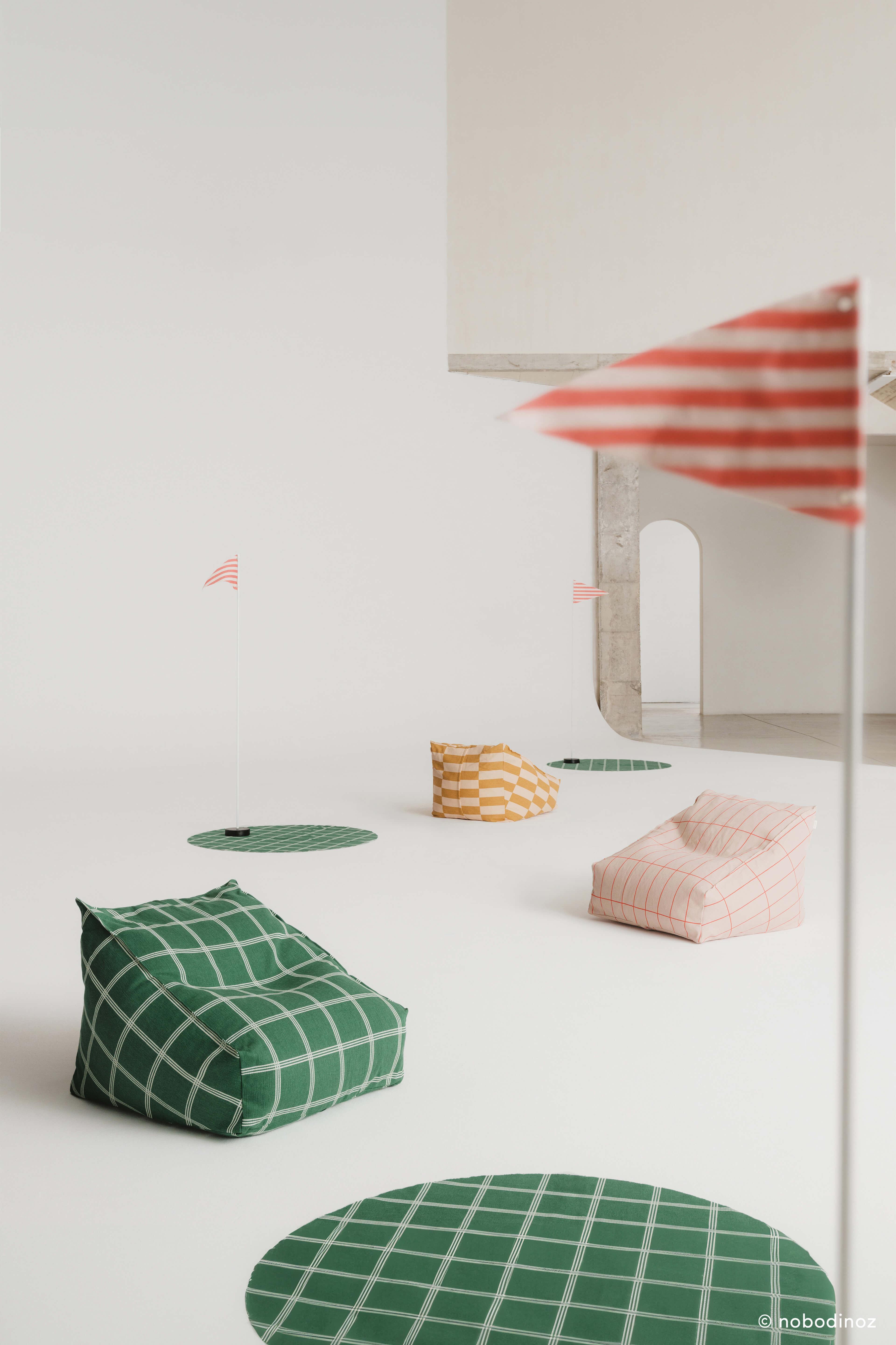 Nobodinoz Vibes armchair bean bag in premium cotton, pink with red grid pattern, minimalist setting