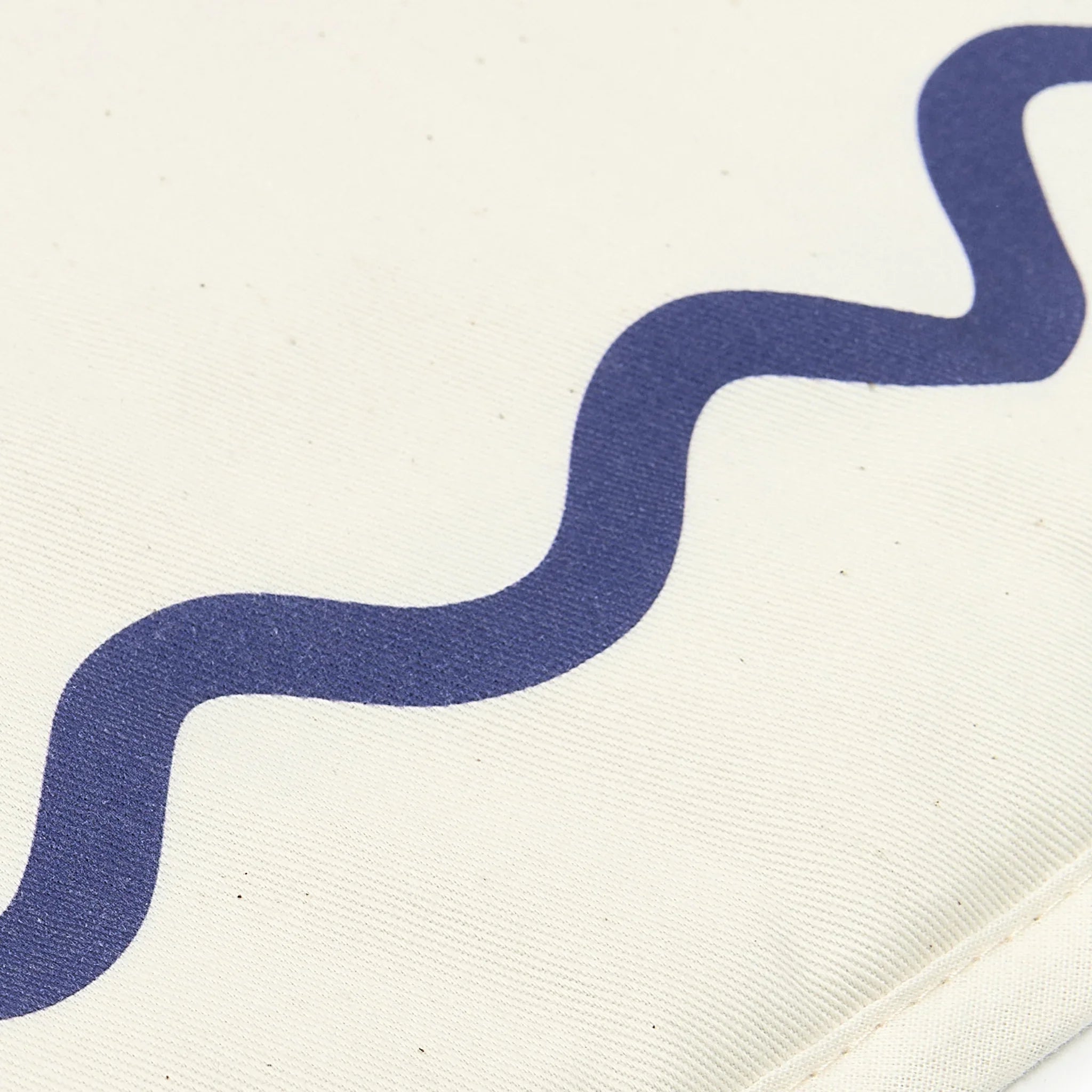 Nobodinoz Vibes playmat in cream cotton with blue wavy print detail
