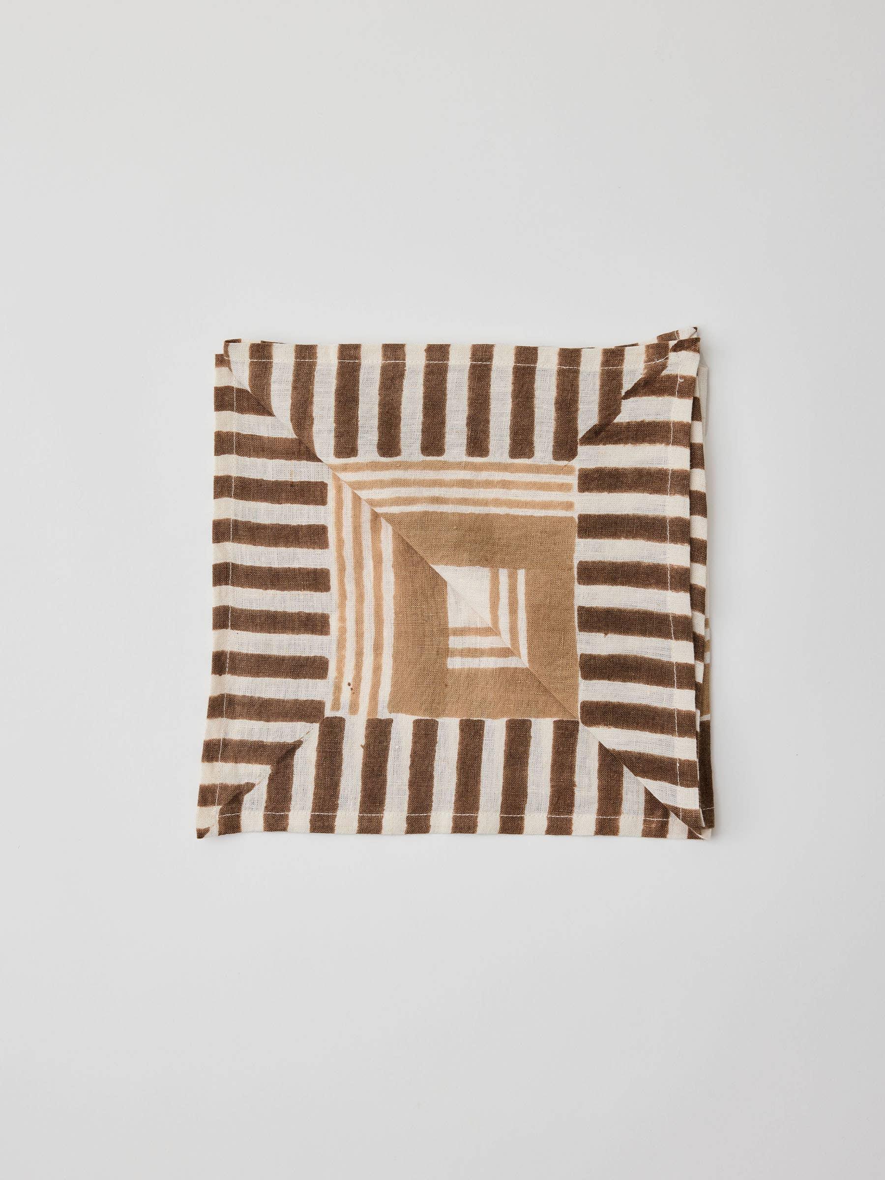 Justine linen napkin in brown and beige geometric striped pattern, premium table linen