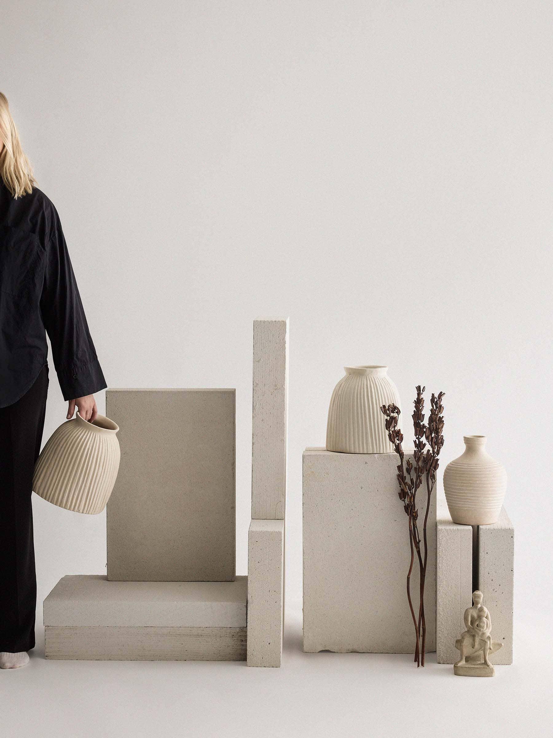 Atelier Stella cream ceramic vases in a minimalist neutral setting with dried flowers