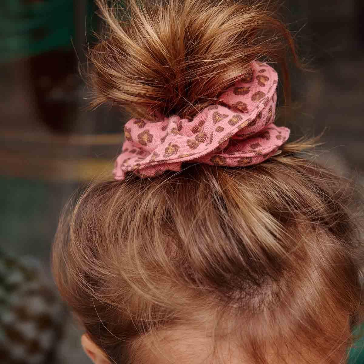 Rockahula pink leopard print cotton scrunchie in girl's brown hair bun