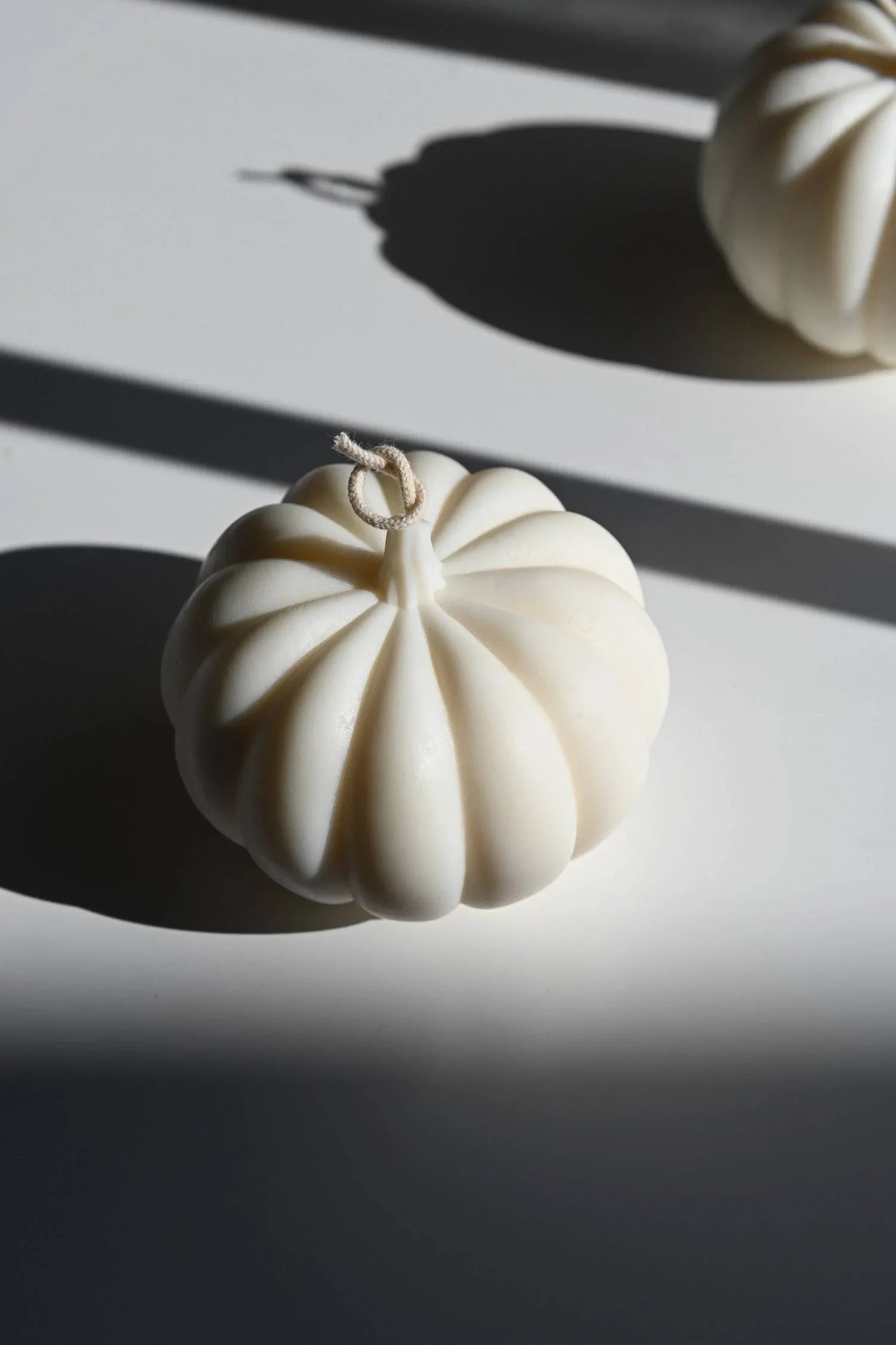 Audrey Victoria pumpkin-shaped soy wax candle in matte white, minimal premium design